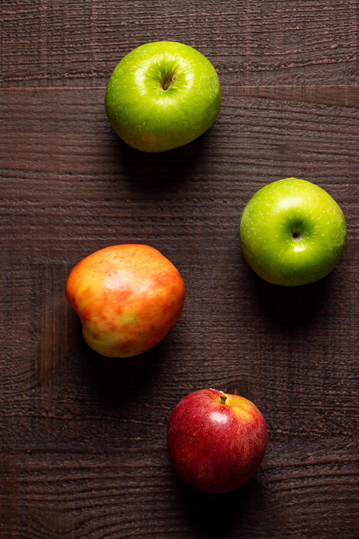 Two green apples and two red apples