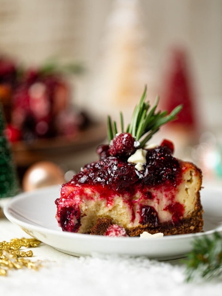 Slice of White Chocolate Cheesecake with Cranberries on a small plate