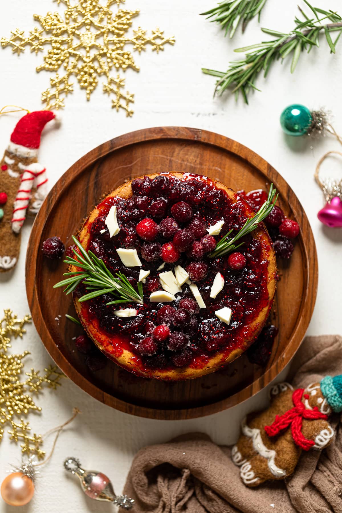 White Chocolate Cheesecake with Cranberries on a wooden board