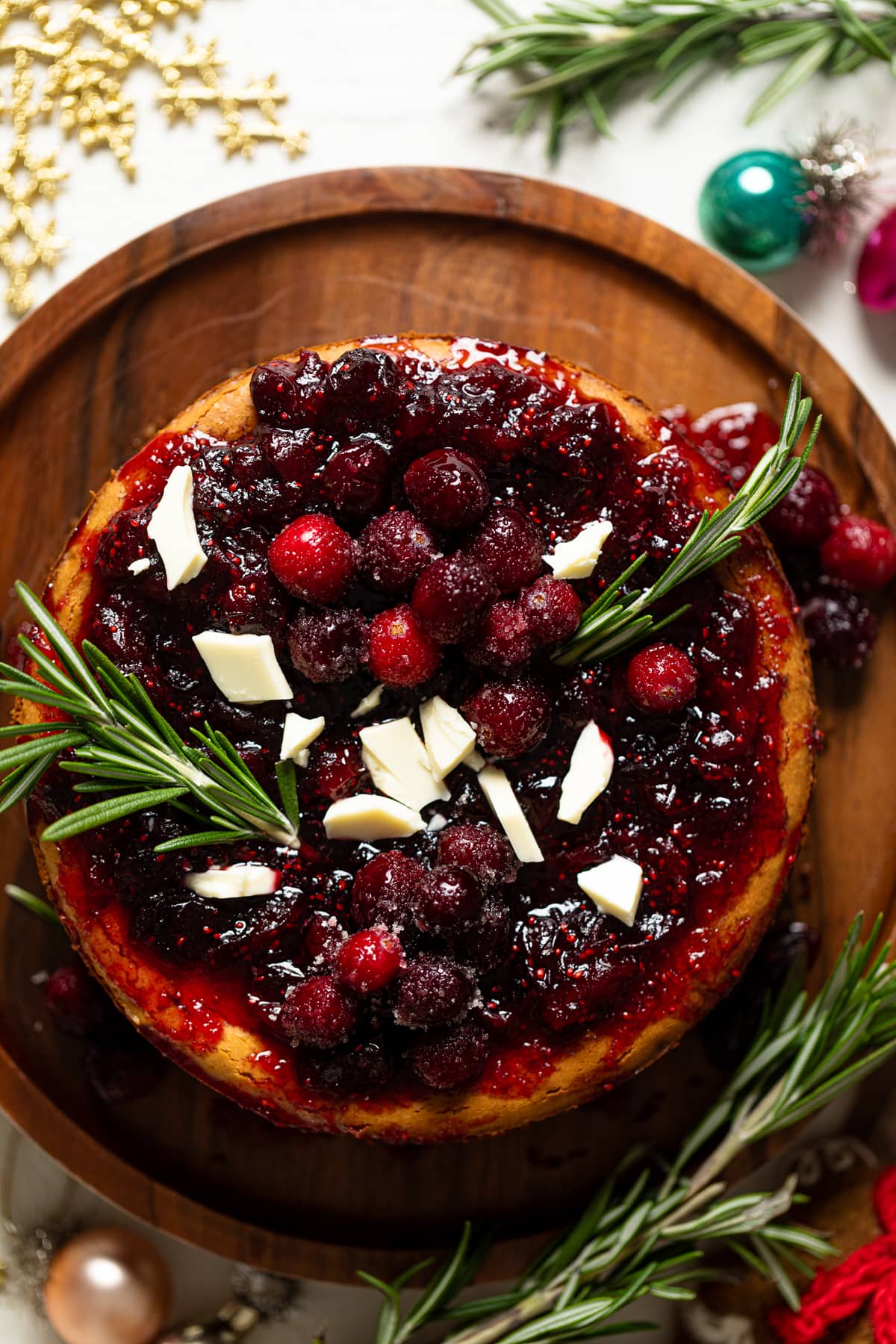 White Chocolate Cheesecake with Cranberries on a wooden board