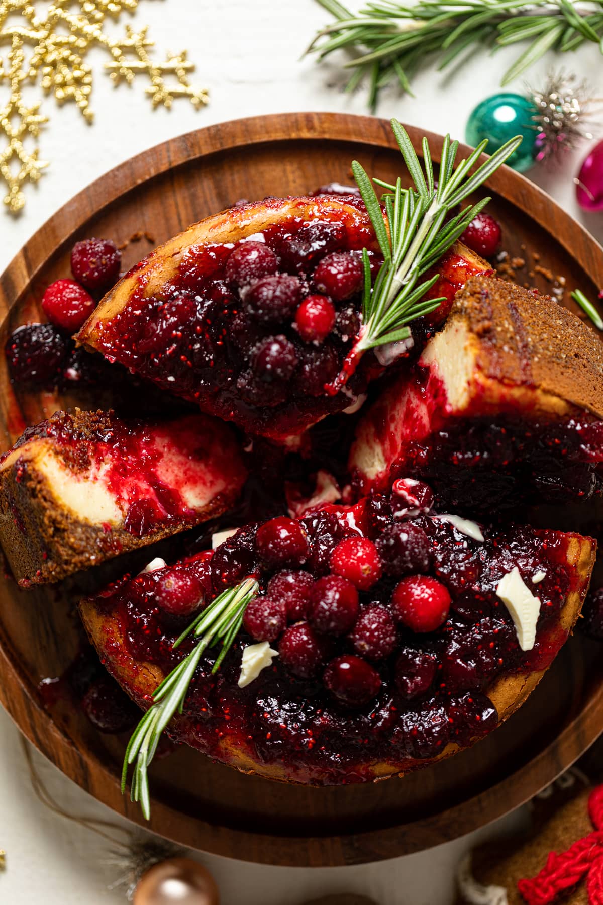 Partially-sliced White Chocolate Cheesecake with Cranberries