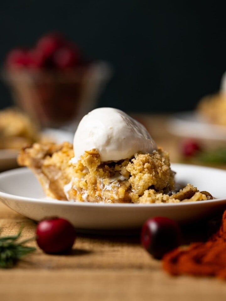 Slice of Dutch Apple Pie topped with ice cream