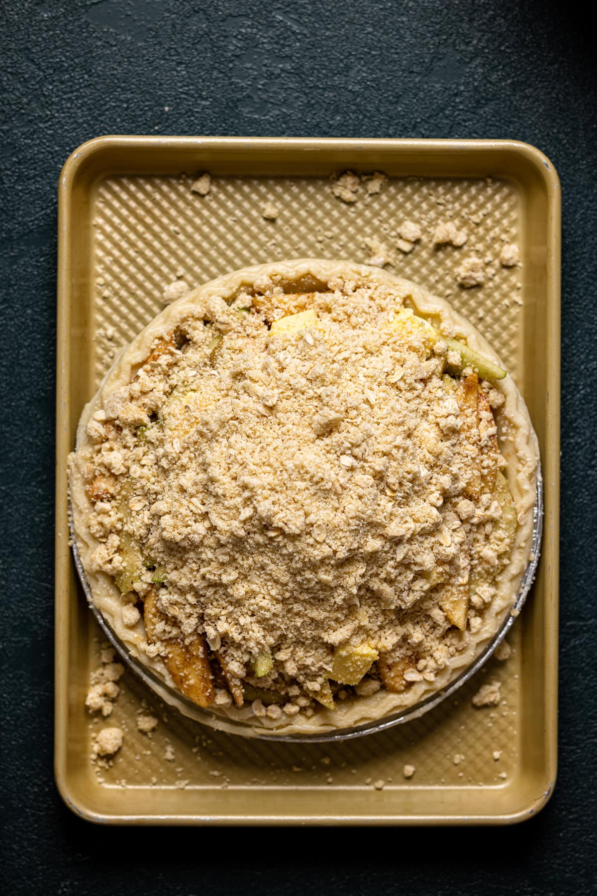 Uncooked Dutch Apple Pie on a baking sheet