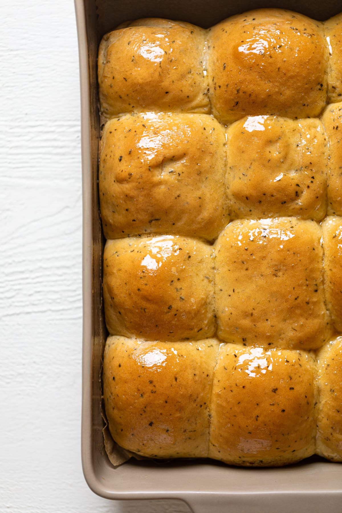 Hot Honey Herb Dinner Rolls in a baking dish