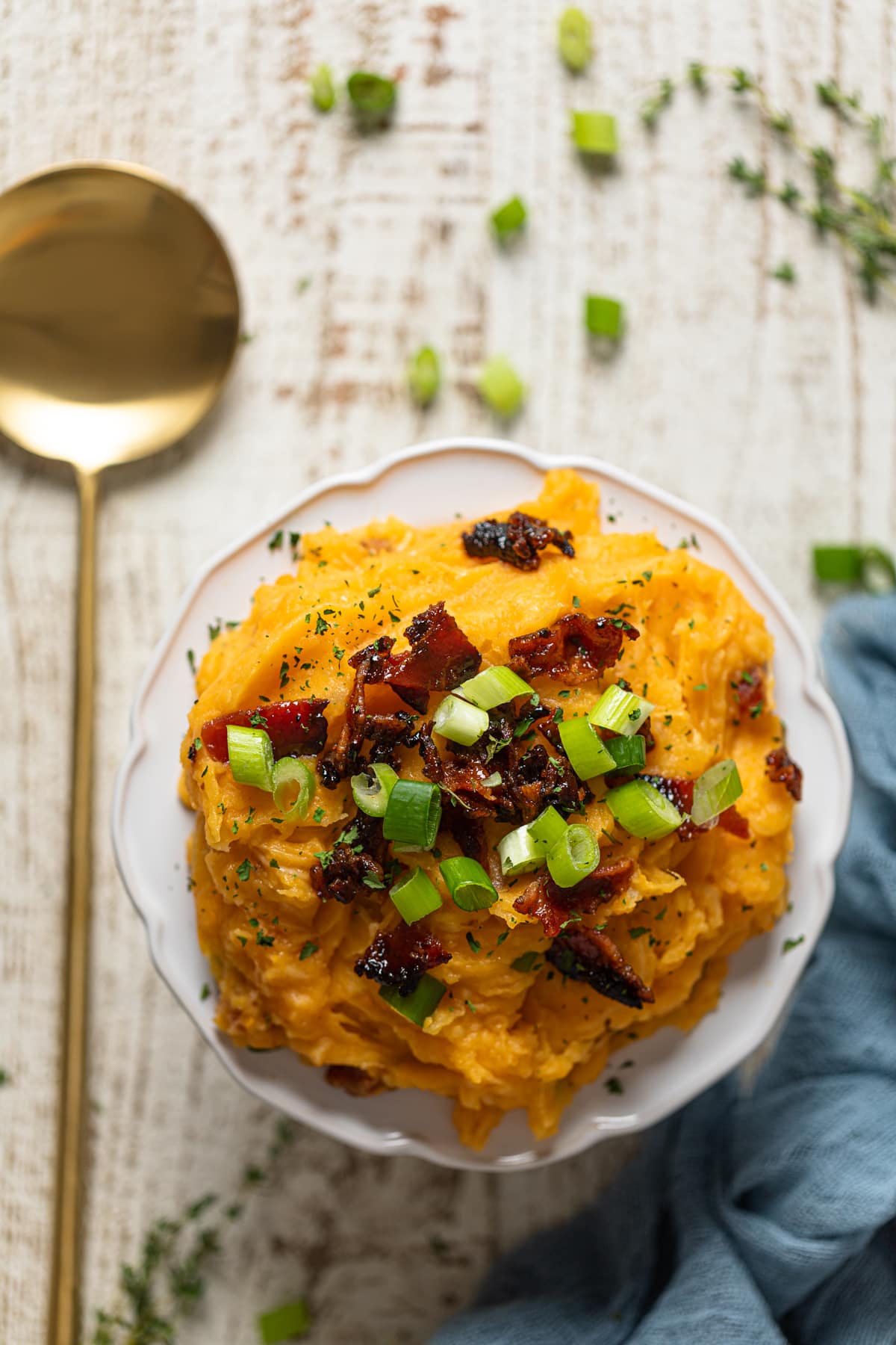 Small plate piled with loaded mashed potatoes