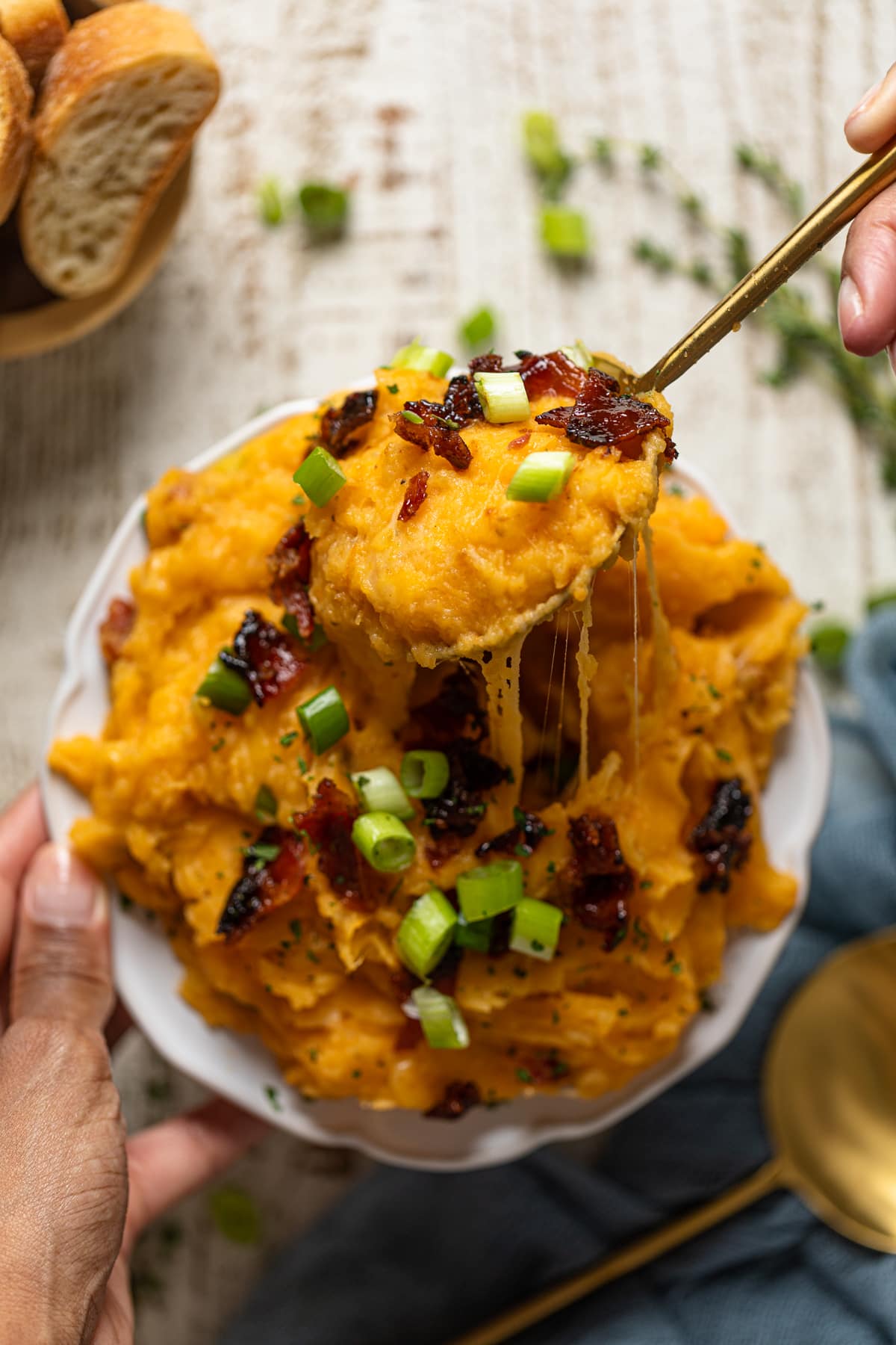 Spoon scooping Loaded Mashed Potatoes