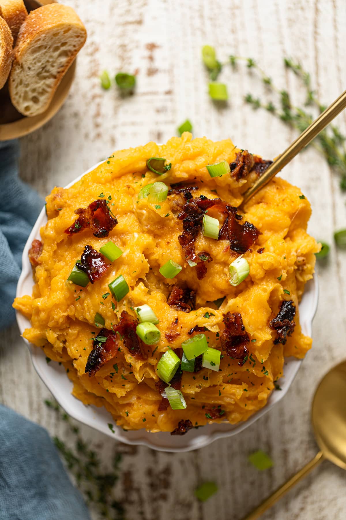 Fork in a pile of Loaded Mashed Potatoes