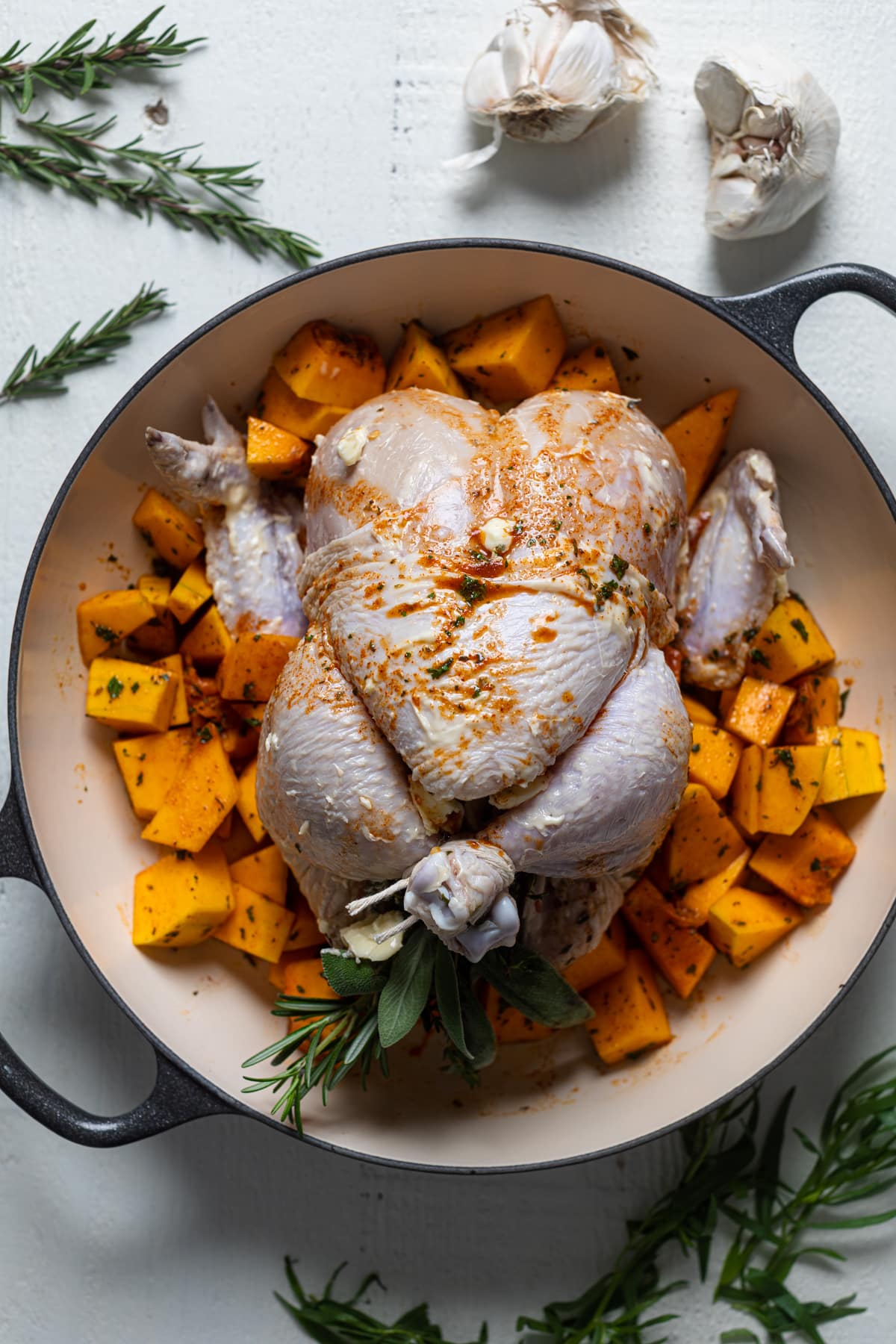 Raw Cranberry Maple Roast Chicken on a bed of cubed butternut squash