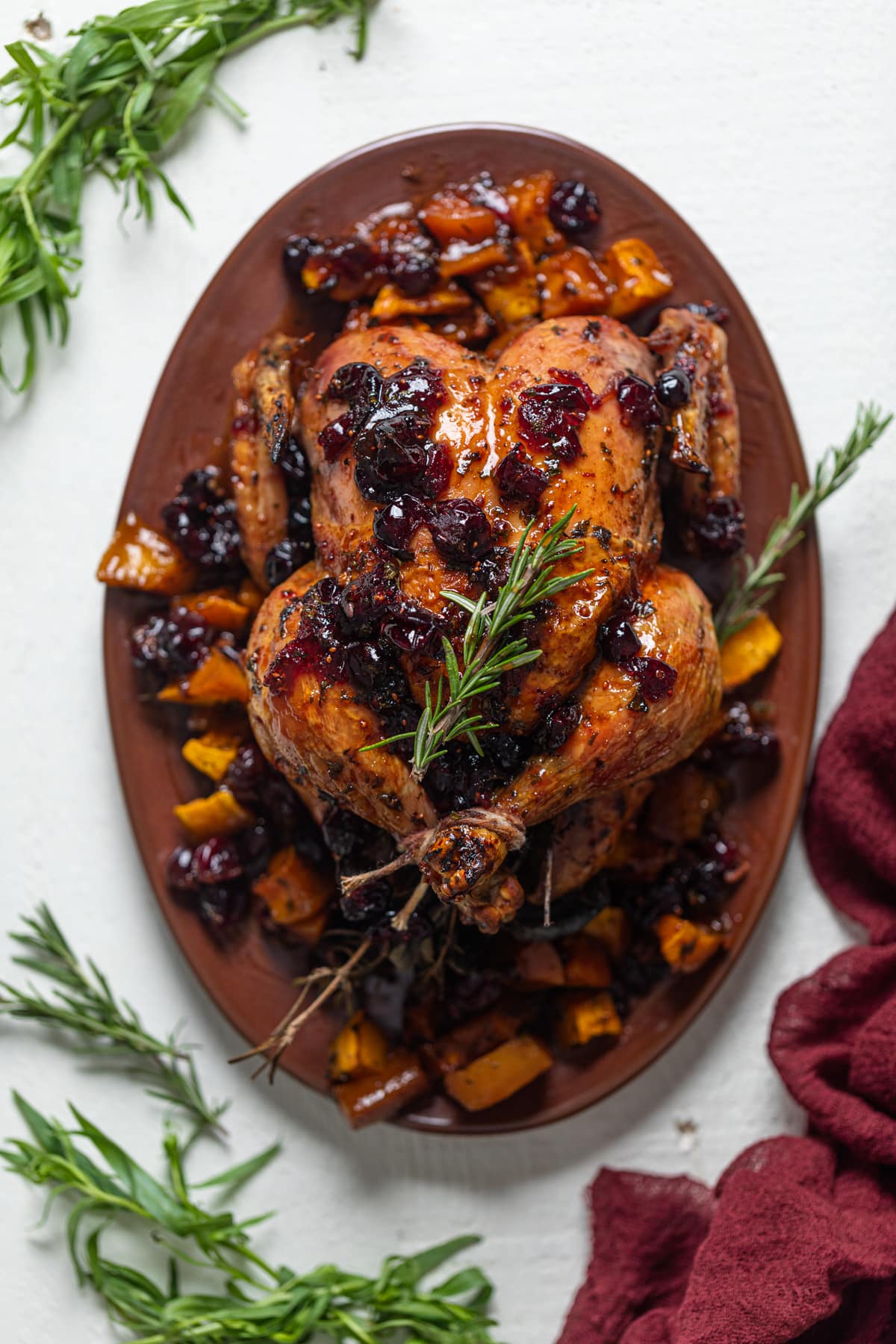 Cranberry Maple Roast Chicken on a bed of roasted butternut squash