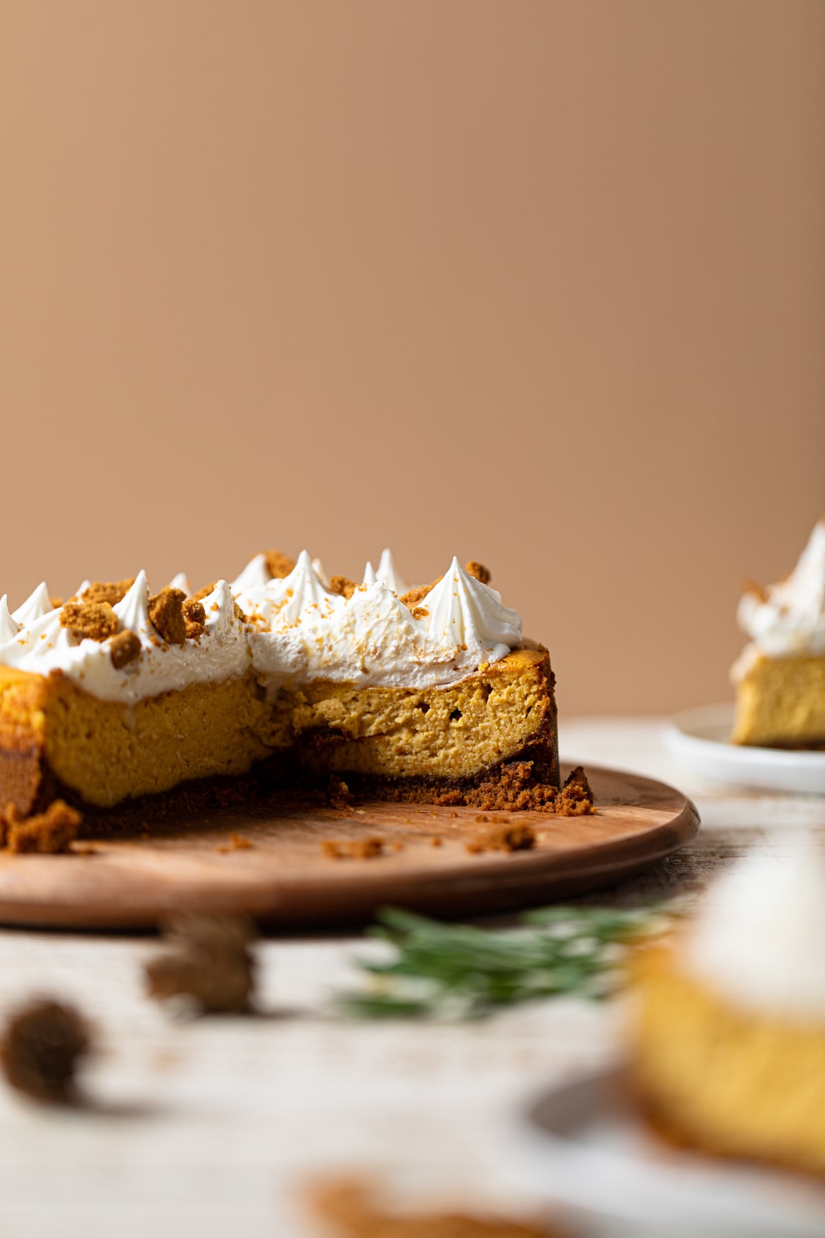 Pumpkin Cheesecake with Biscoff Cookies missing some slices