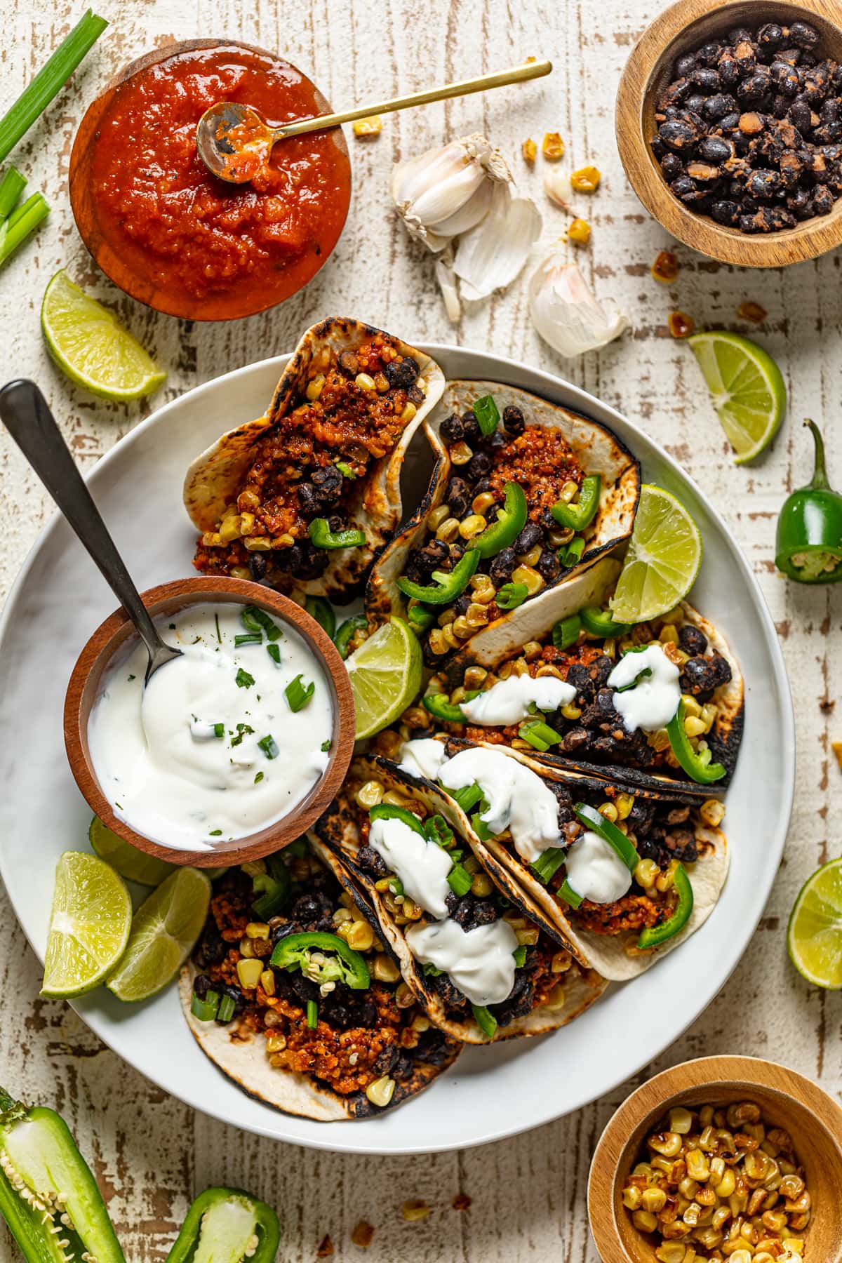 Plate of Spicy Sofritas Quinoa Tacos and lime sour cream