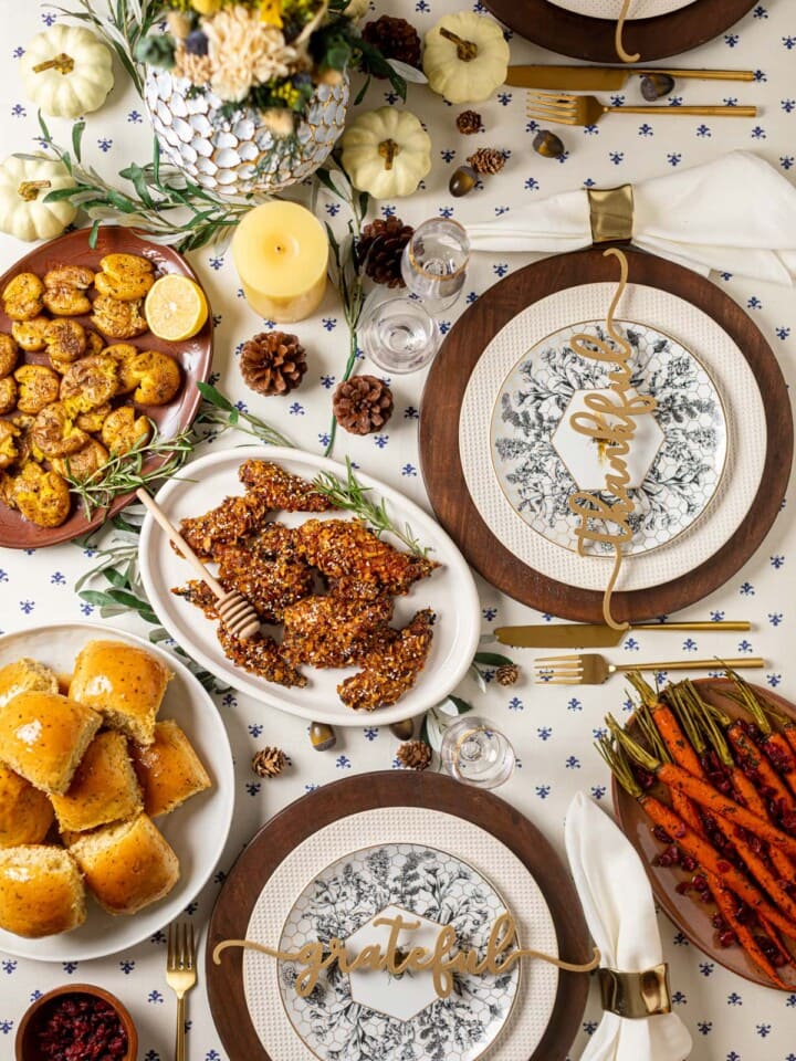 Table set with Thanksgiving foods and decorations