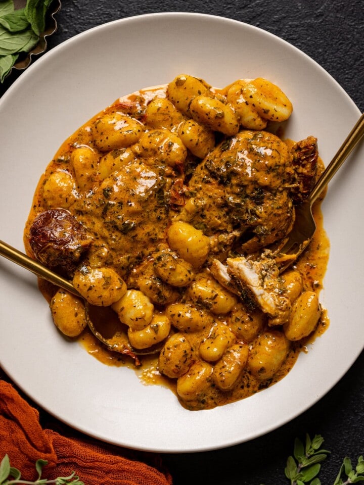 Plate of Creamy Tuscan 'Marry Me' Chicken with silverware