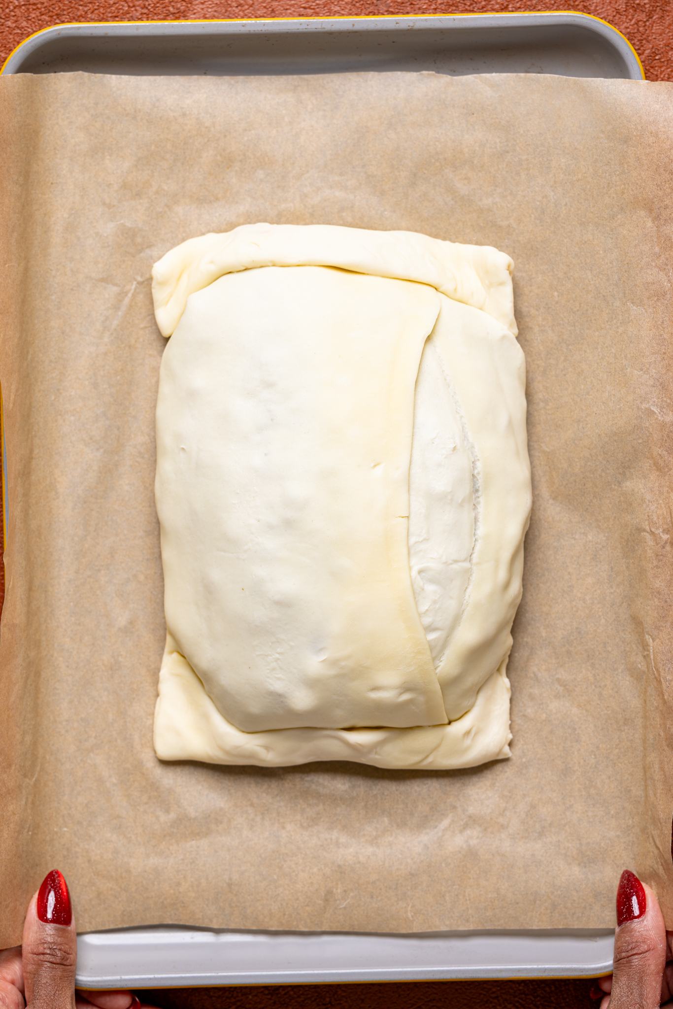 Image of vegan Wellington assembled on a baking sheet with parchment. 