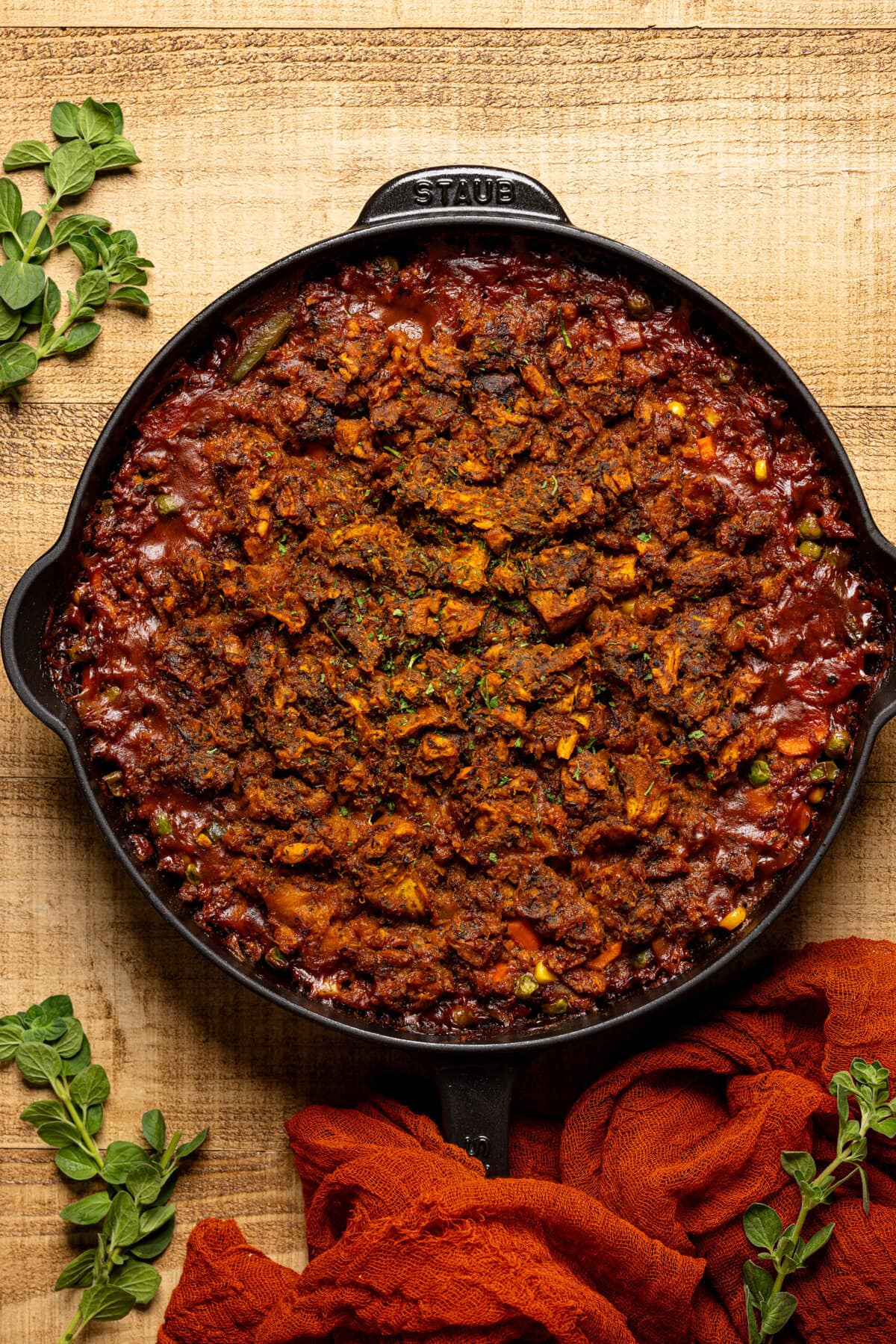 Baked shepherd's pie in a black skillet.