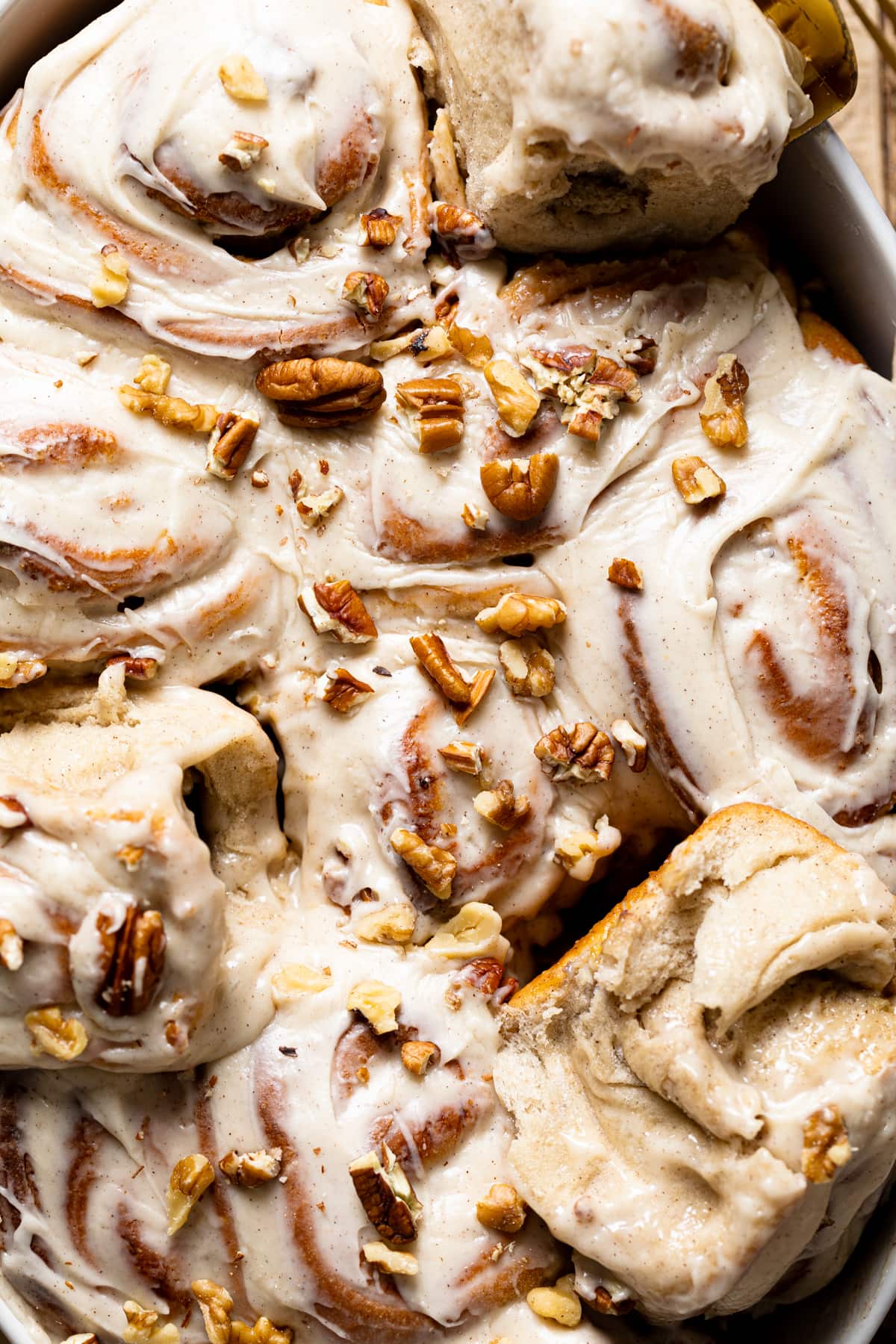 Closeup of Banana Bread Cinnamon Rolls with Maple Cream Cheese Frosting 