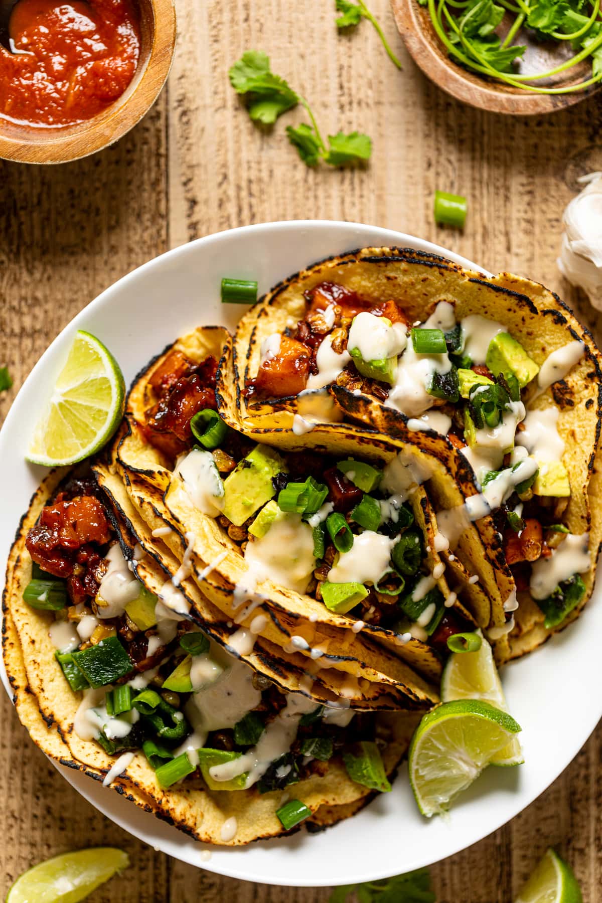 Chipotle BBQ Butternut Squash Tacos drizzled with dairy-free garlic lime sauce