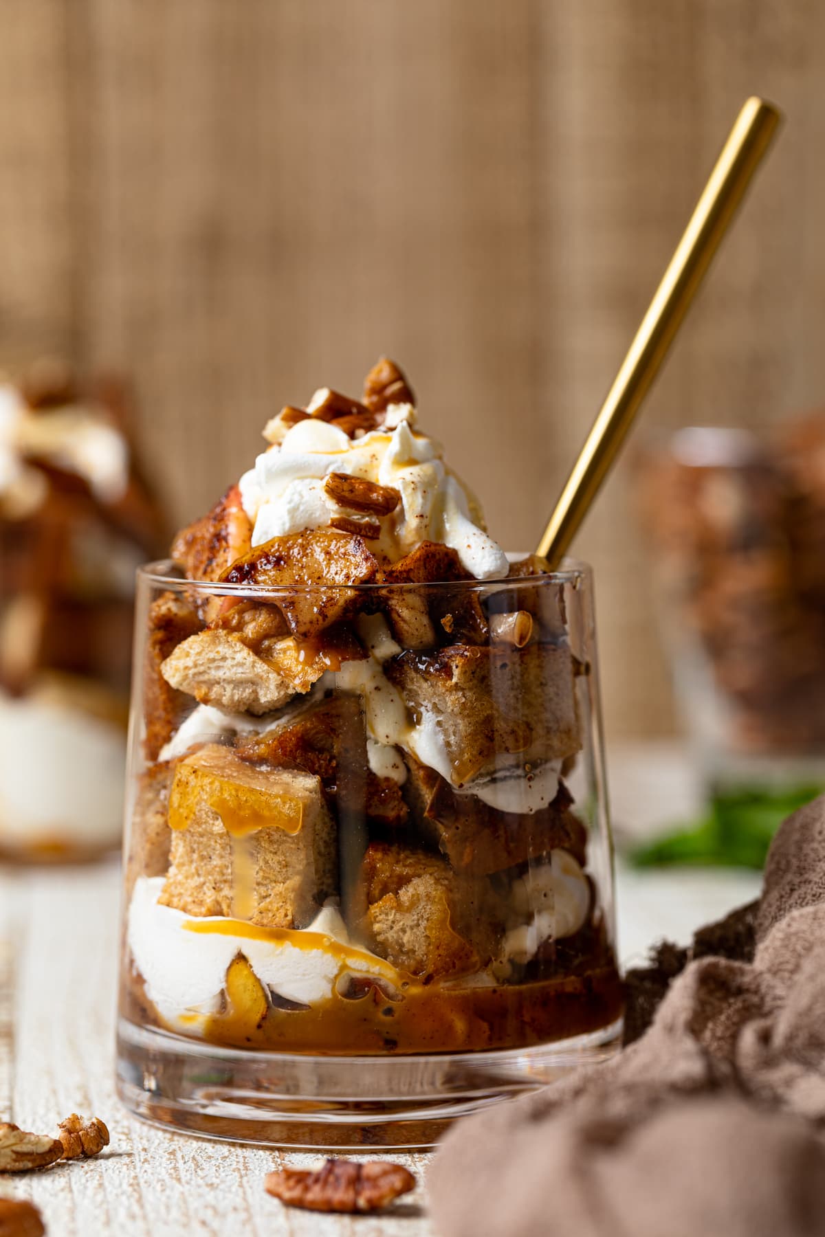 Caramel Apple French Toast Parfait in a glass with a spoon