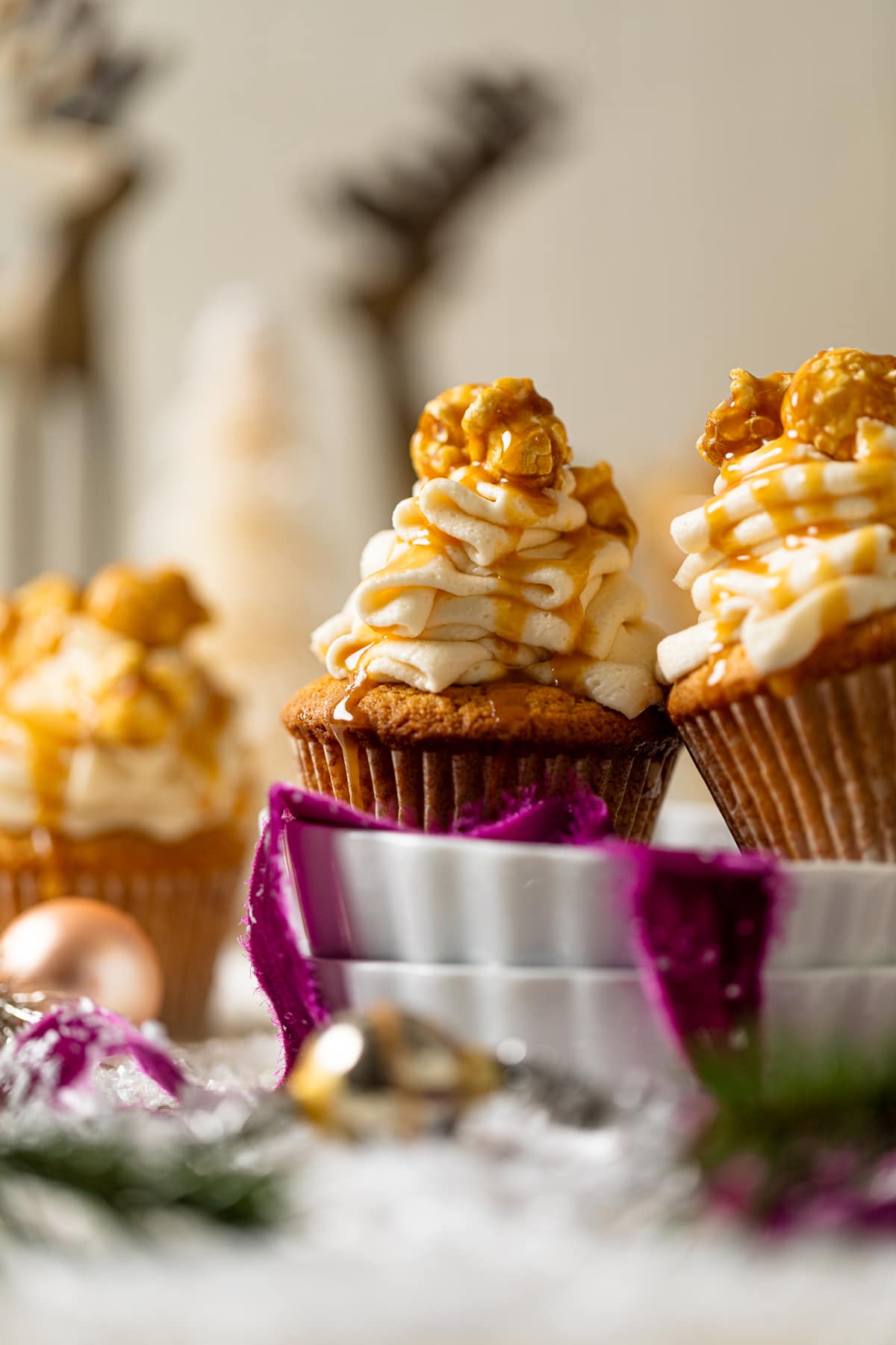 Caramel Eggnog Cupcakes on two stacked plates