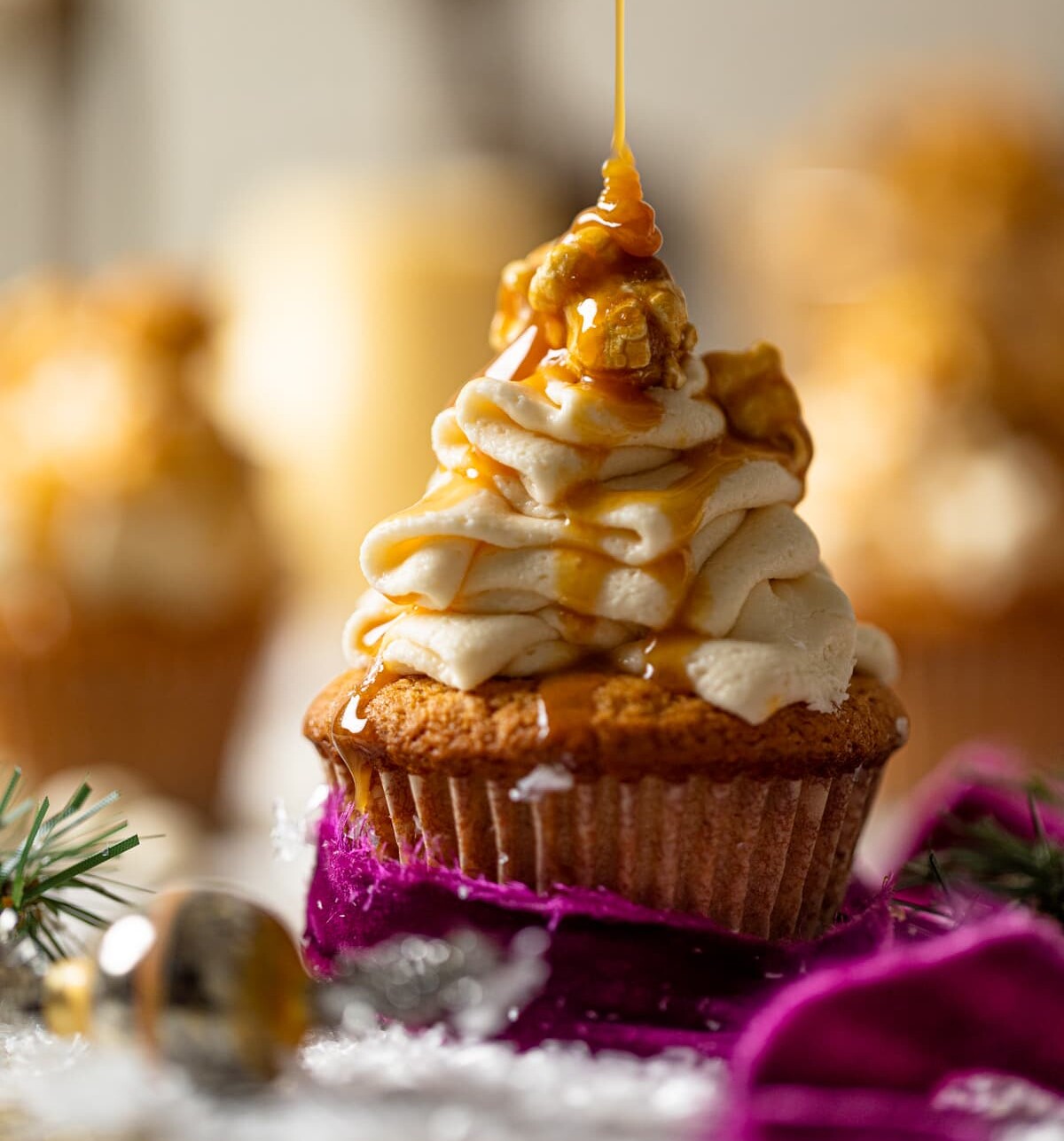 Caramel drizzling onto a Caramel Eggnog Cupcake