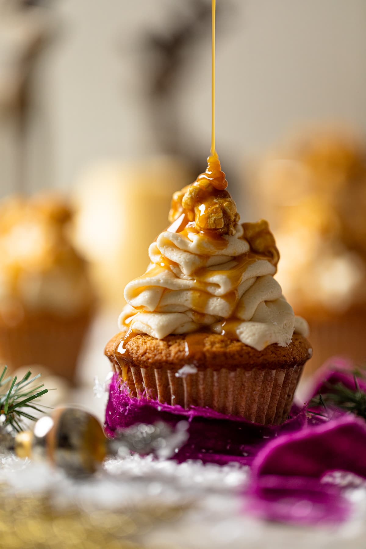 Caramel drizzling onto a Caramel Eggnog Cupcake