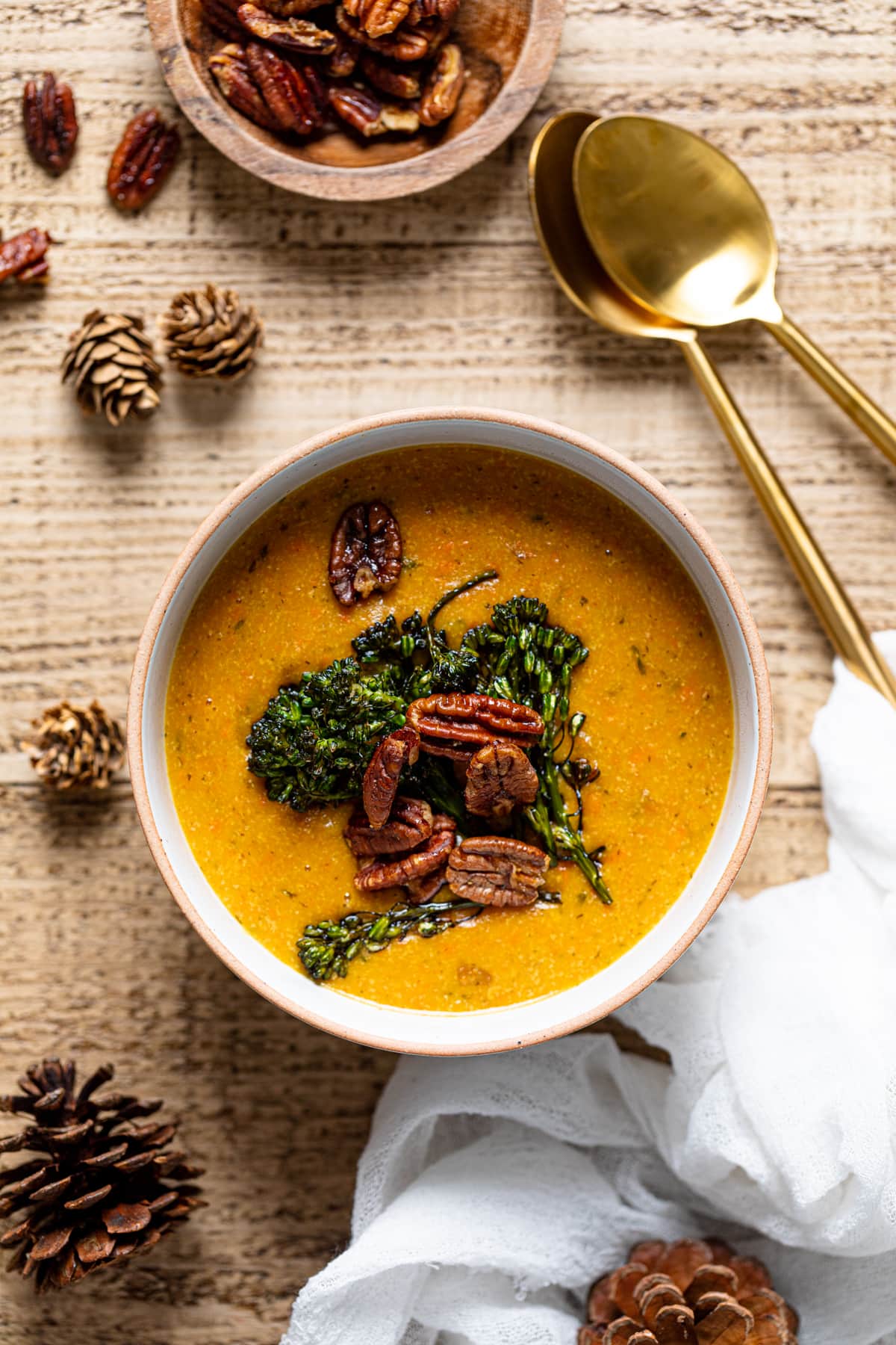 Overhead shot of a bowl of plant-based Cheddar Carrot Apple Soup