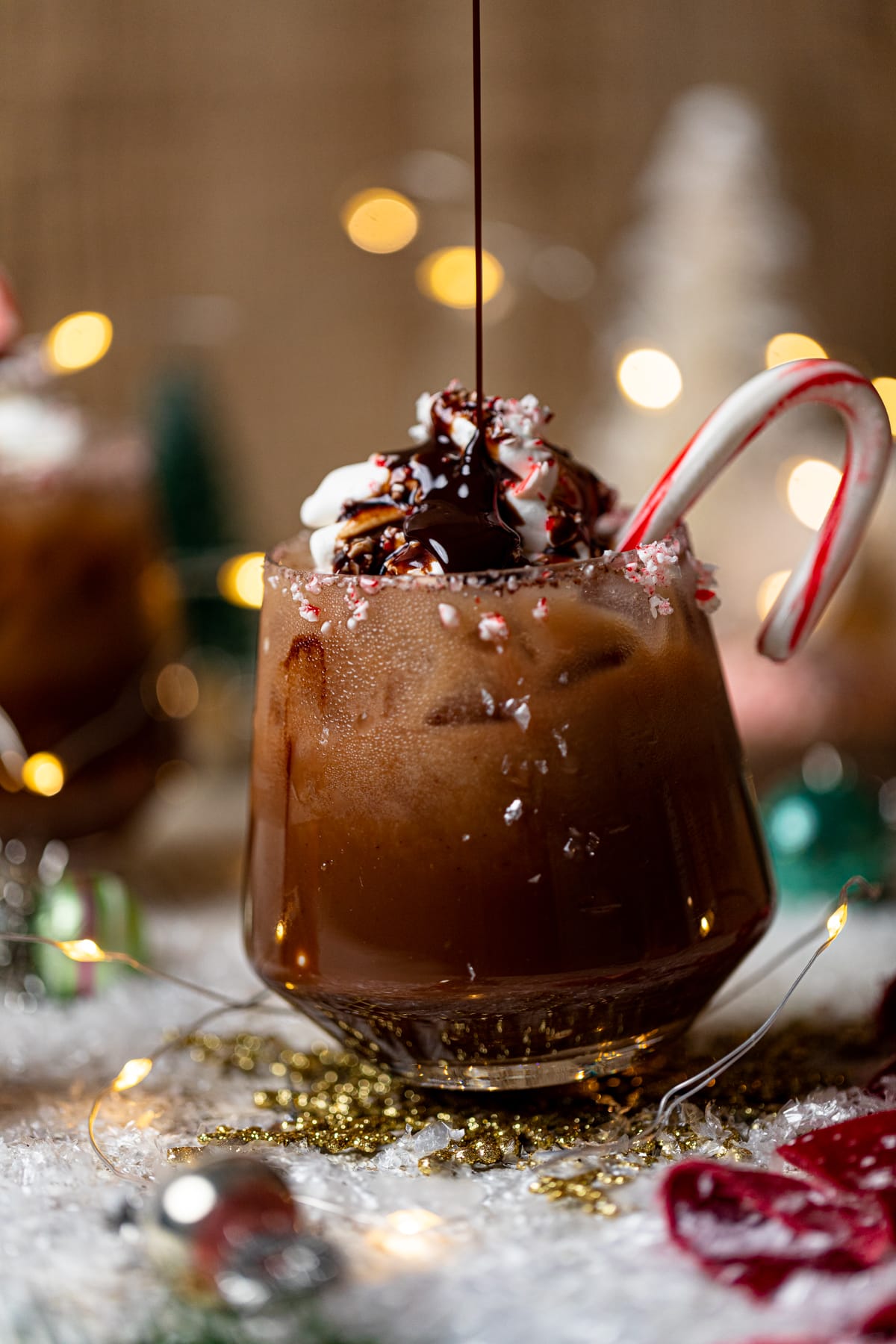 Chocolate syrup pouring onto a Chocolate Christmas Mocktail 