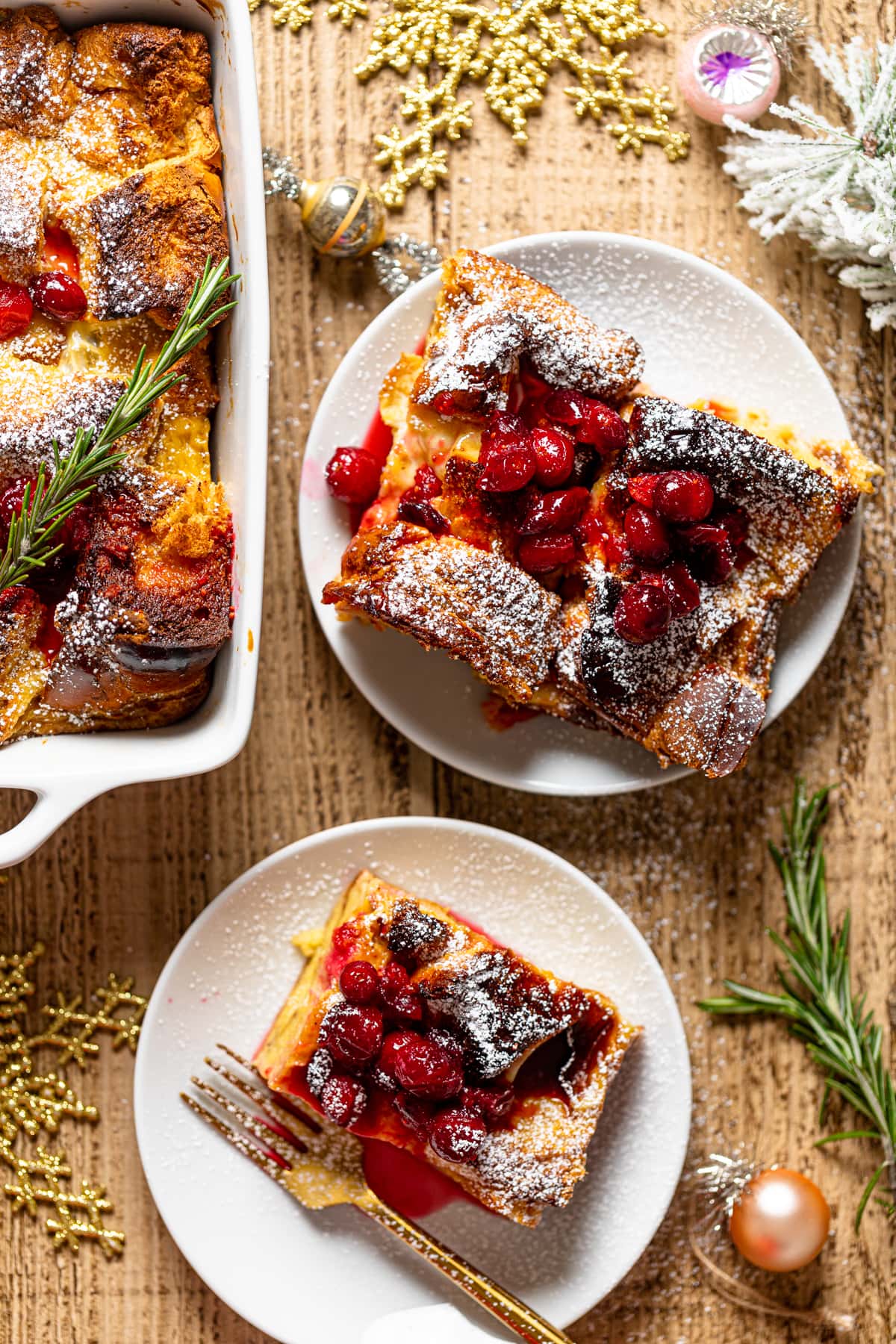 Pieces of Baked Eggnog French Toast on small plates