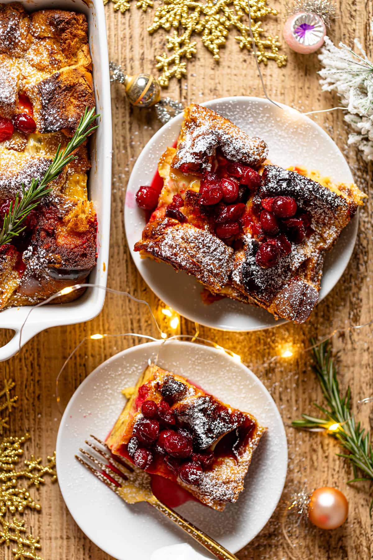 Pieces of Baked Eggnog French Toast on small plates