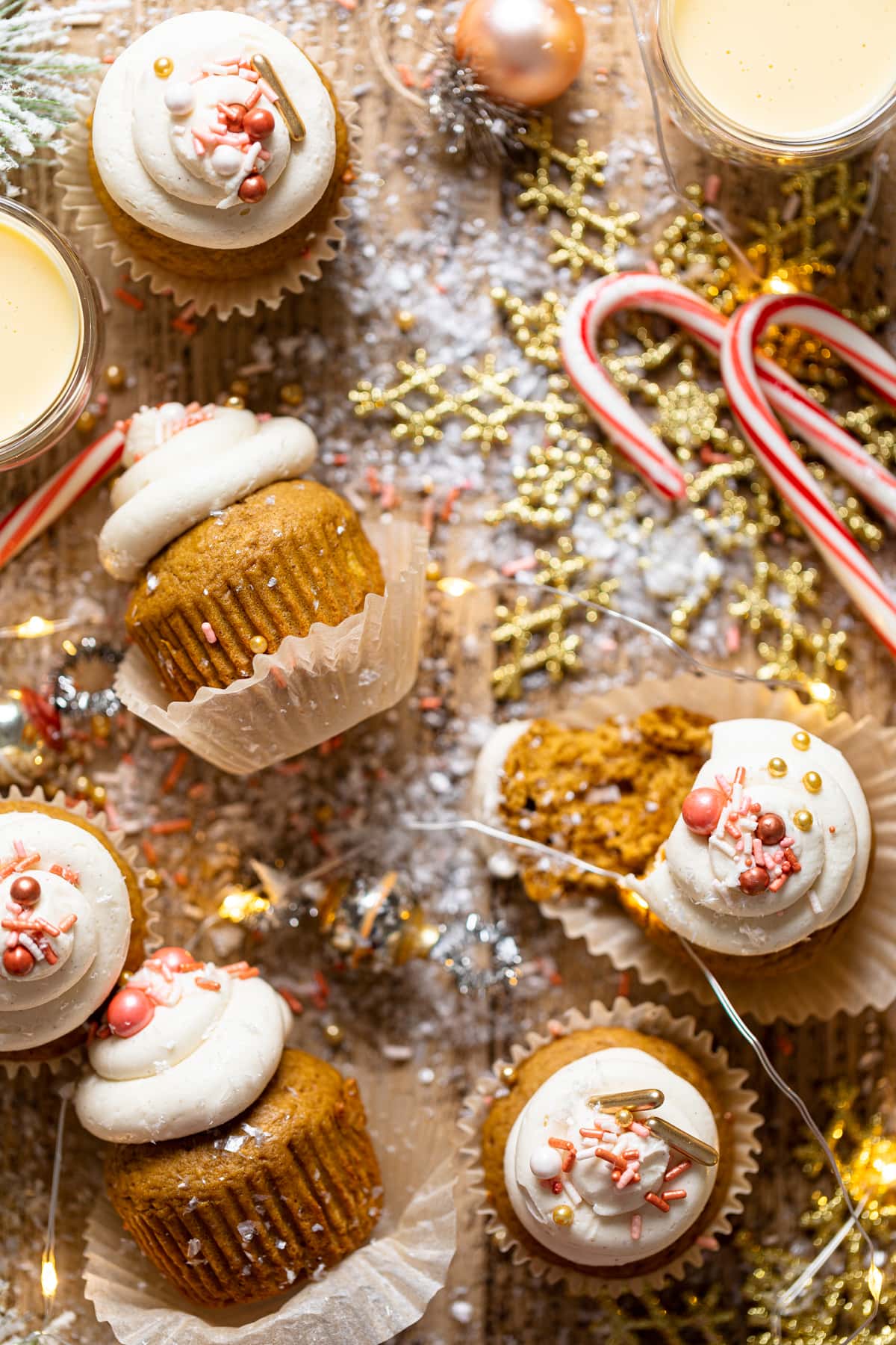 Gingerbread Cupcakes with Eggnog Frosting on a table with Christmas decorations