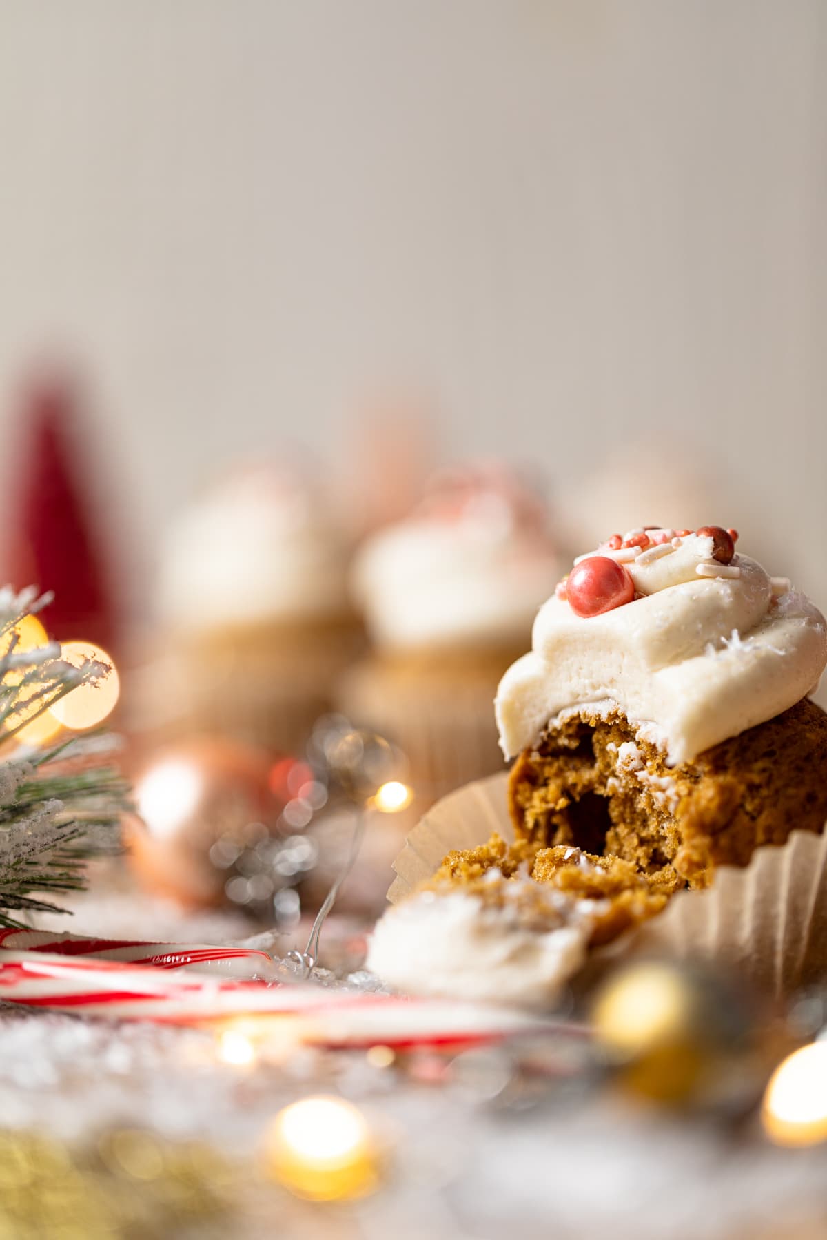 Gingerbread Cupcakes with Eggnog Frosting, missing a bite