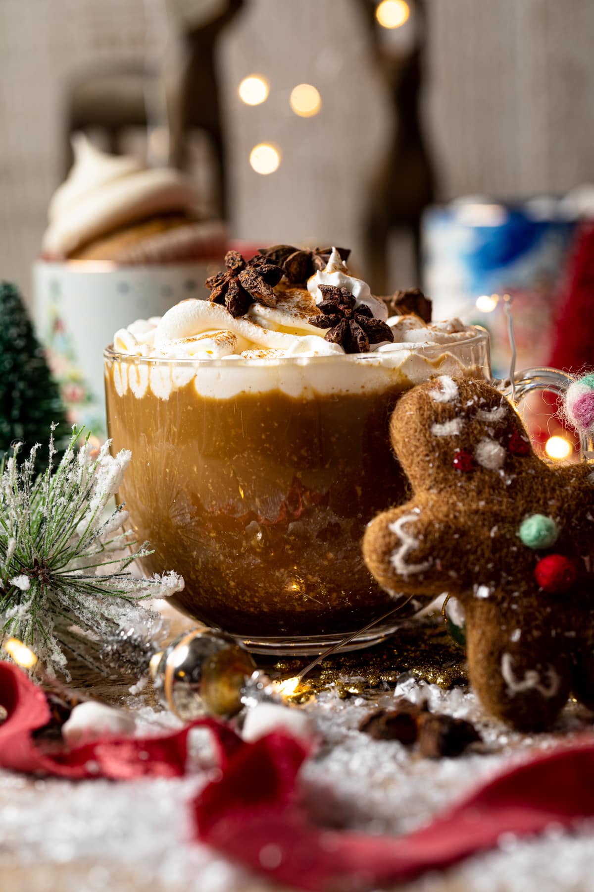 Gingerbread man leaning up against a Vegan Gingerbread Latte