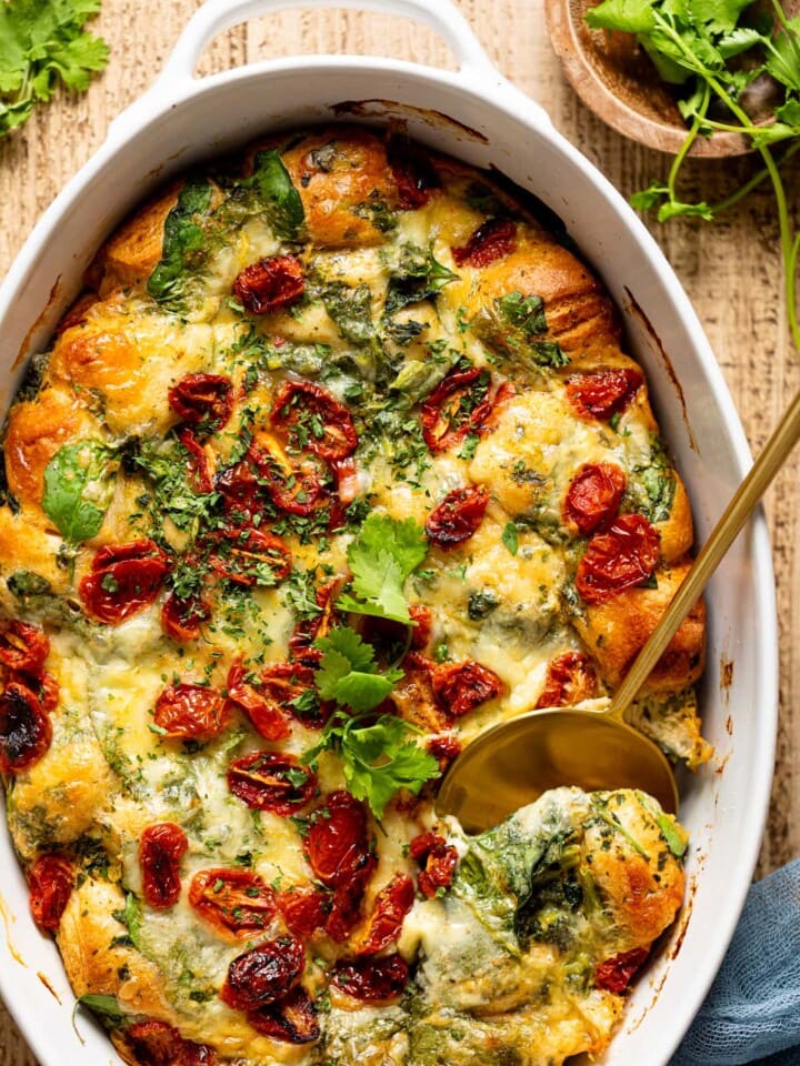 Serving spoon scooping some Veggie Breakfast Strata