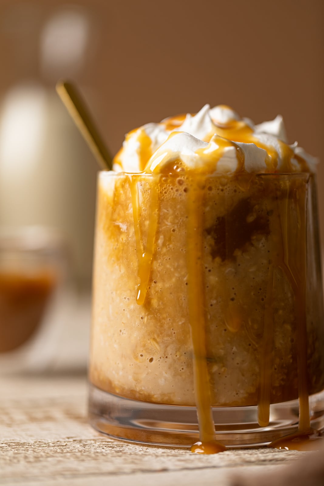 Closeup of a small glass of caramel latte overnight oats