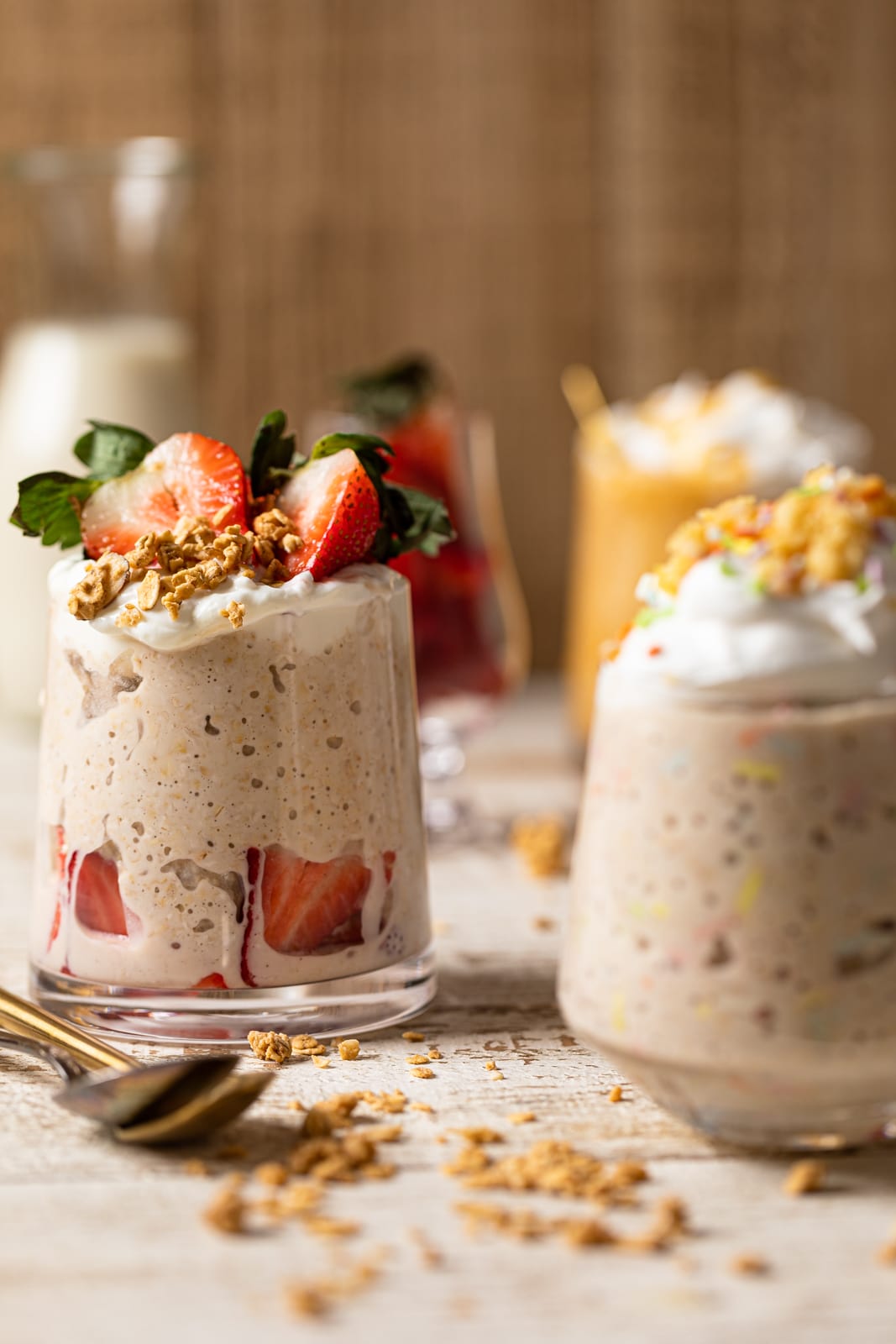 Small glasses of overnight oats on a white table