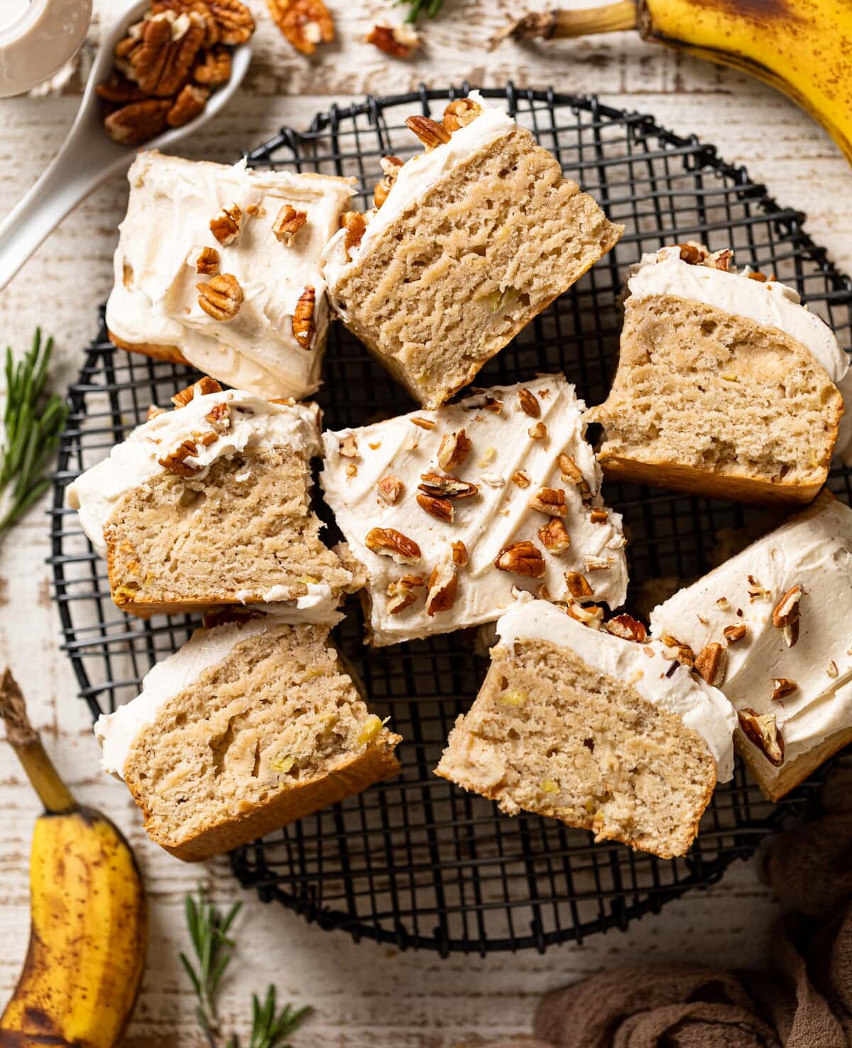 Pieces of Banana Oatmeal Sheet Cake on a wire serving platter