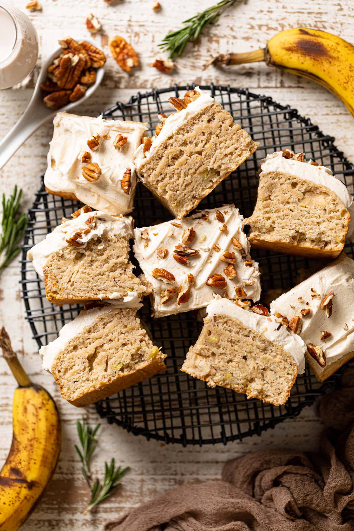 Pieces of Banana Oatmeal Sheet Cake recipe on a wire serving platter