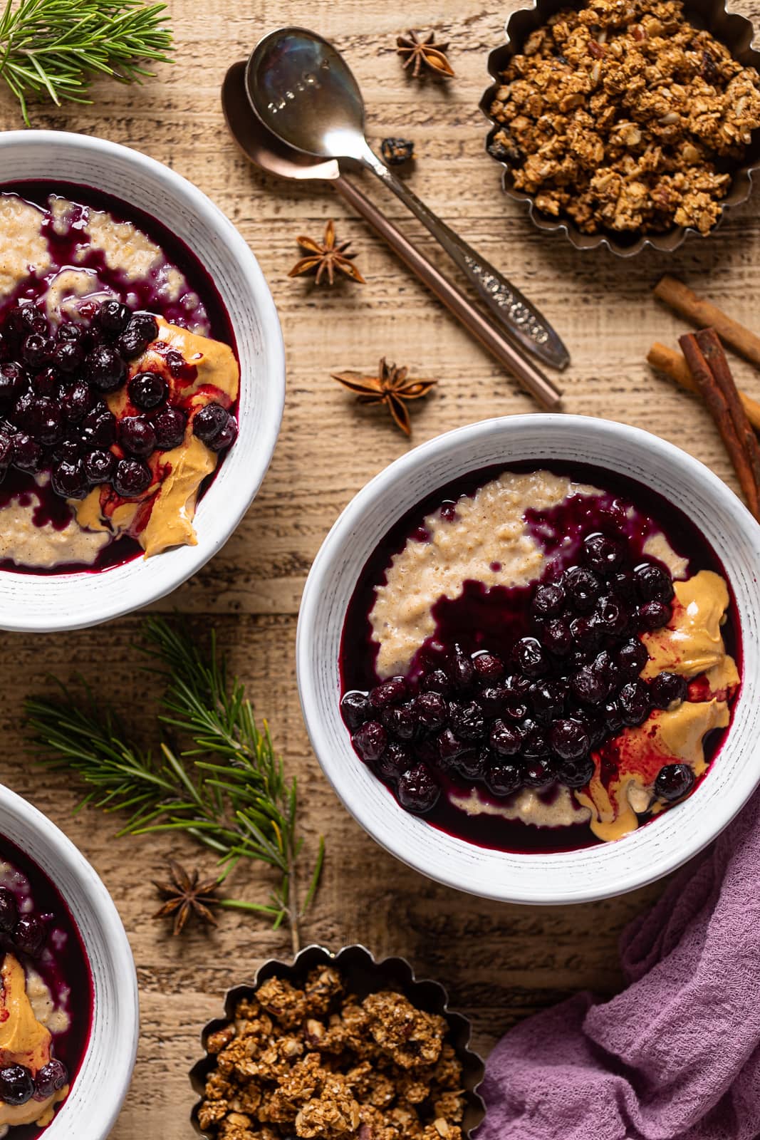 Overhead shot of bowls of Maple Blueberry Oatmeal Porridge