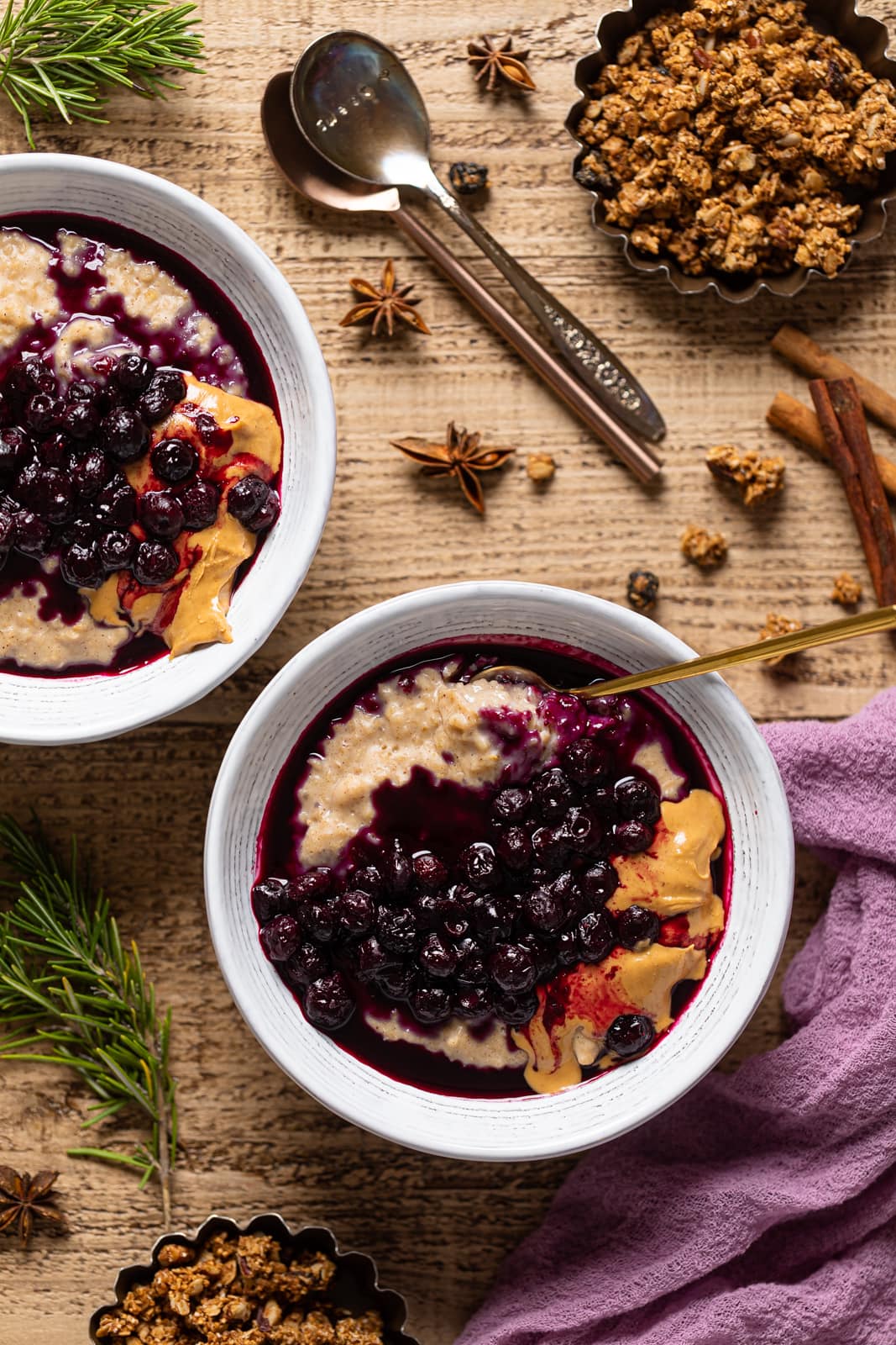 Overhead shot of two bowls of Maple Blueberry Oatmeal Porridge