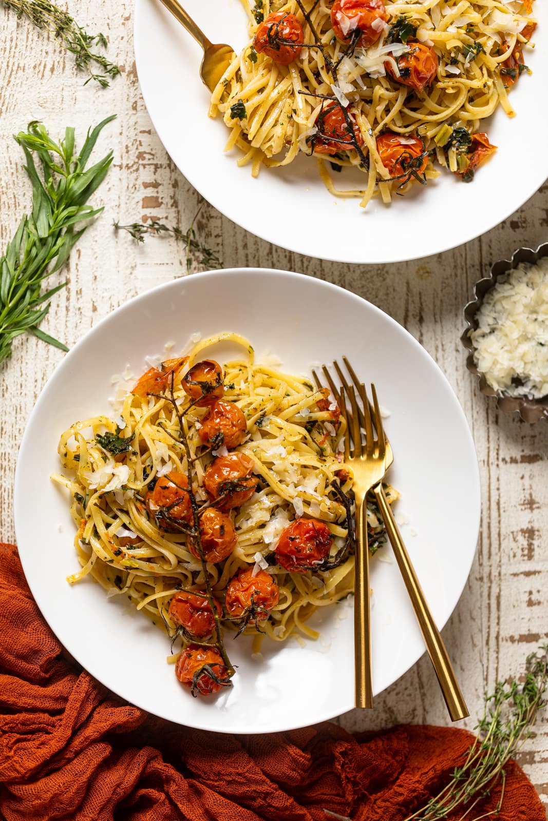 Two plates of Easy Bruschetta Pasta with Parmesan