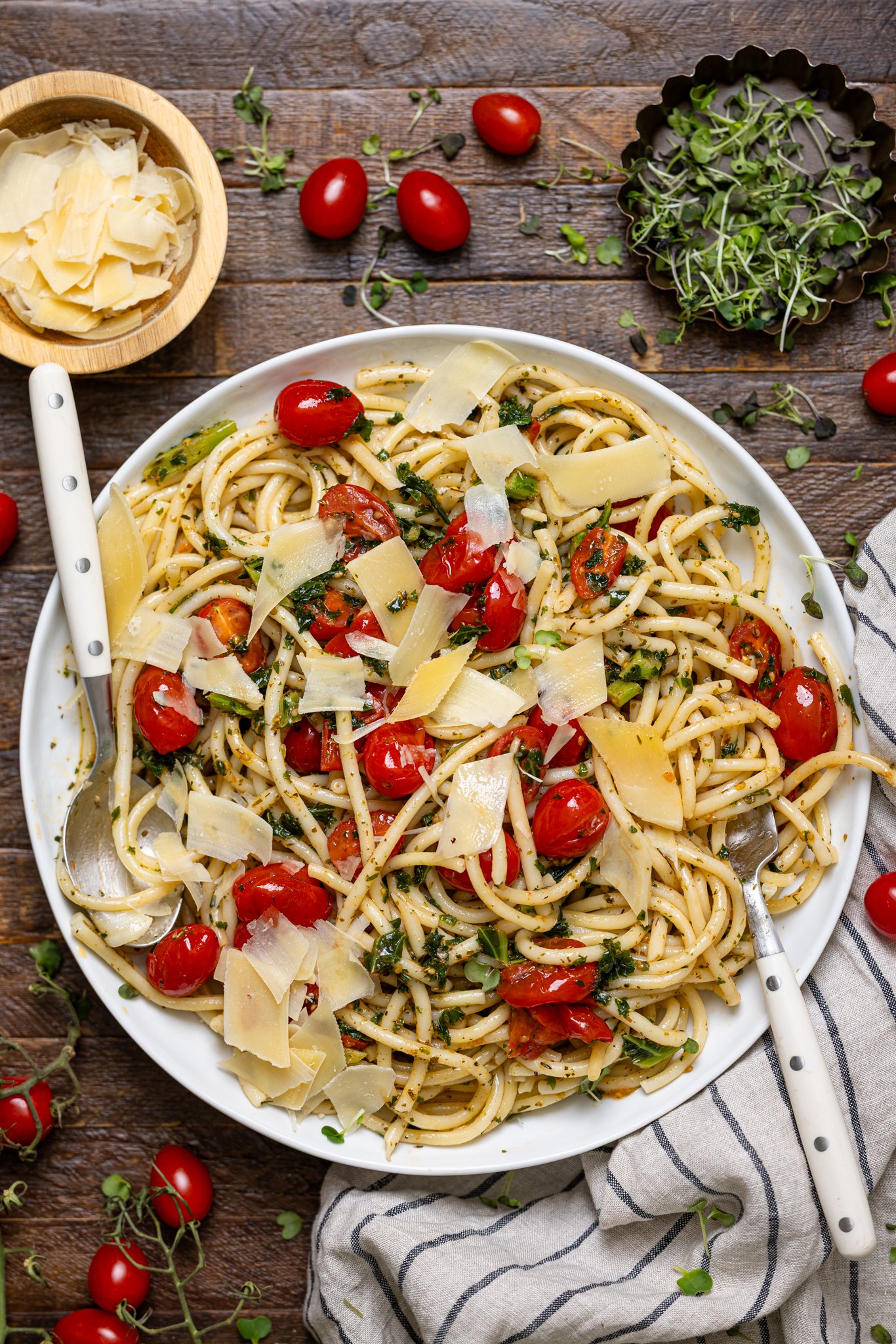 Easy Bruschetta Pasta with Parmesan on a serving platter with forks.