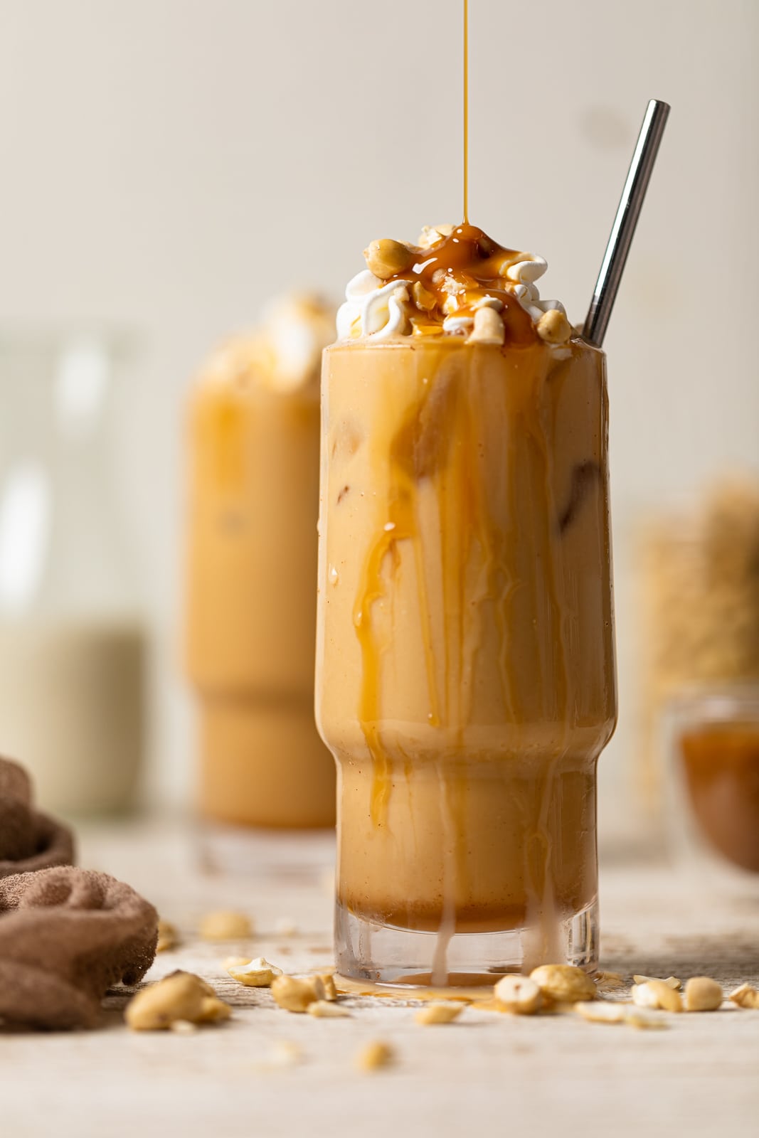 Caramel drizzling onto a Salted Caramel Cashew Latte