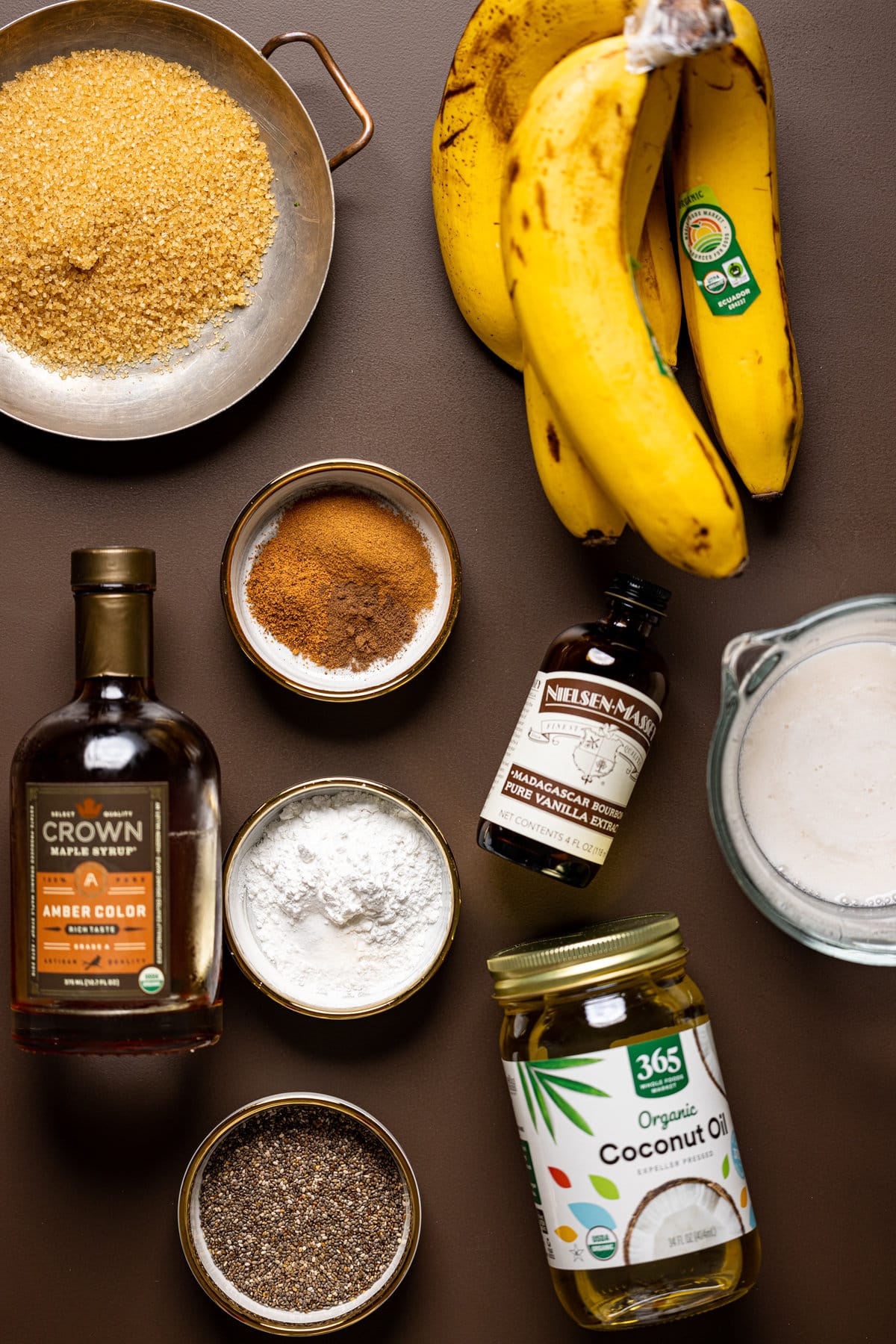 Ingredients for Vegan Chia Seed Maple Banana Bread including bananas, vanilla extract, coconut oil, and maple syrup