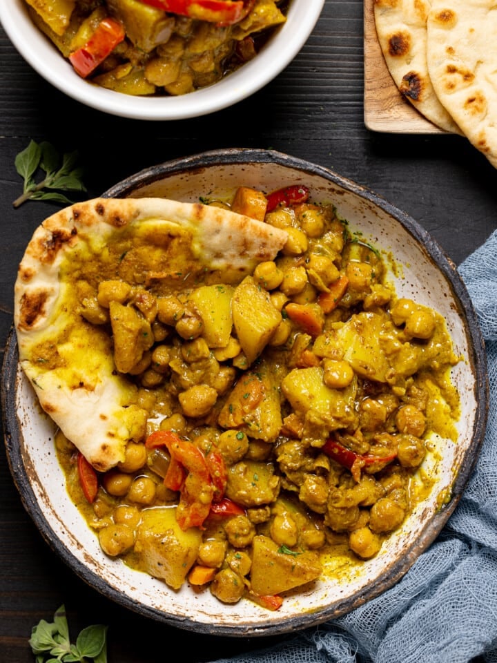 Up close of curry with naan bread.