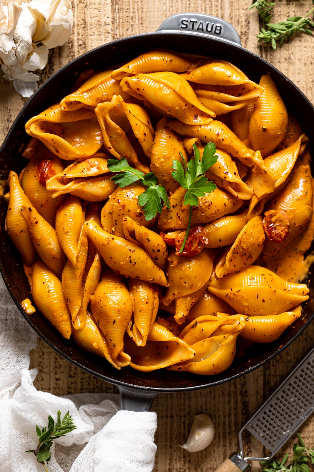 Overhead shot of a skillet of Creamy Garlic Tomato Conchiglioni Pasta