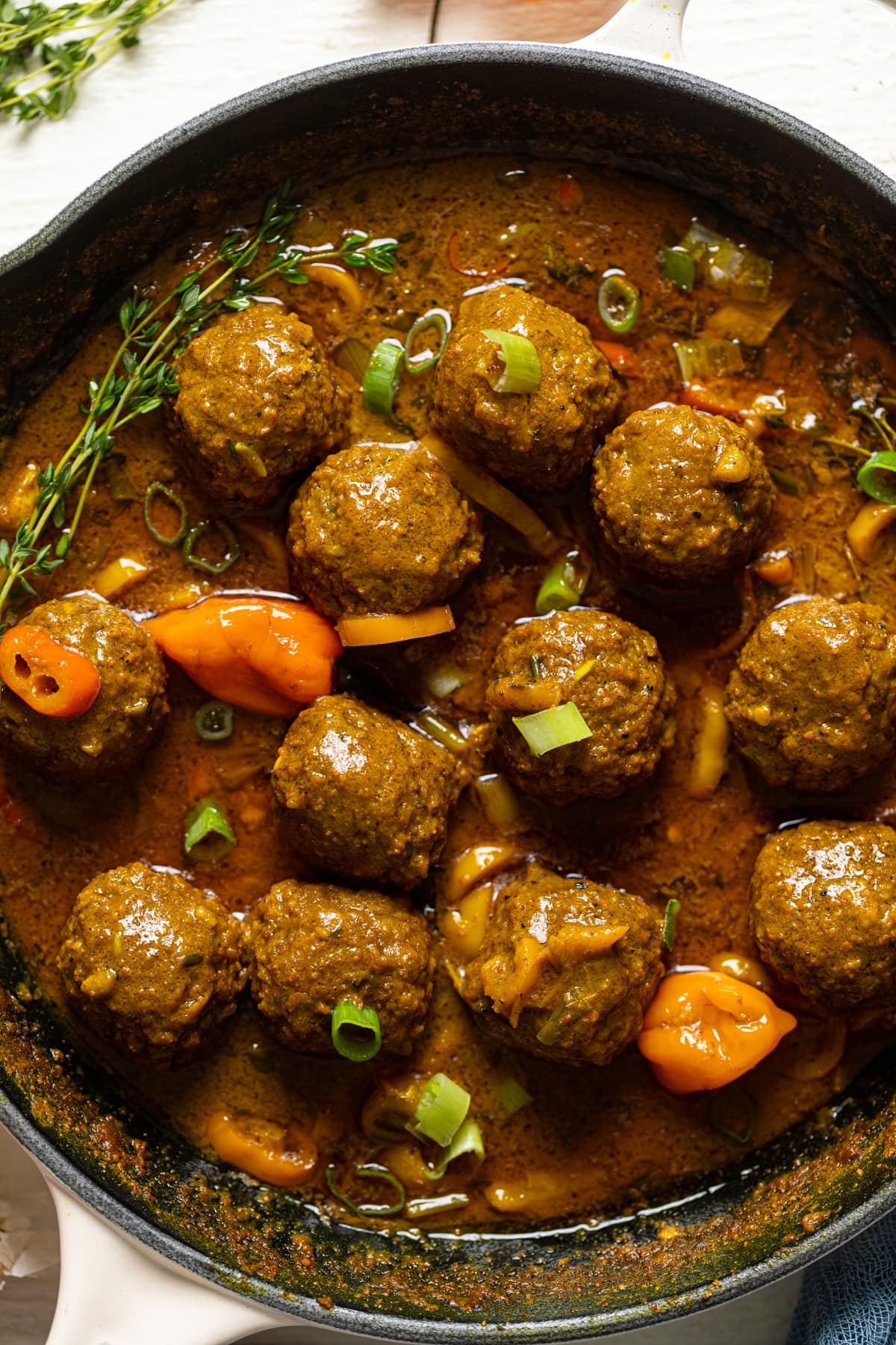 Closeup of a skillet of Spicy Curry Vegan Meatballs