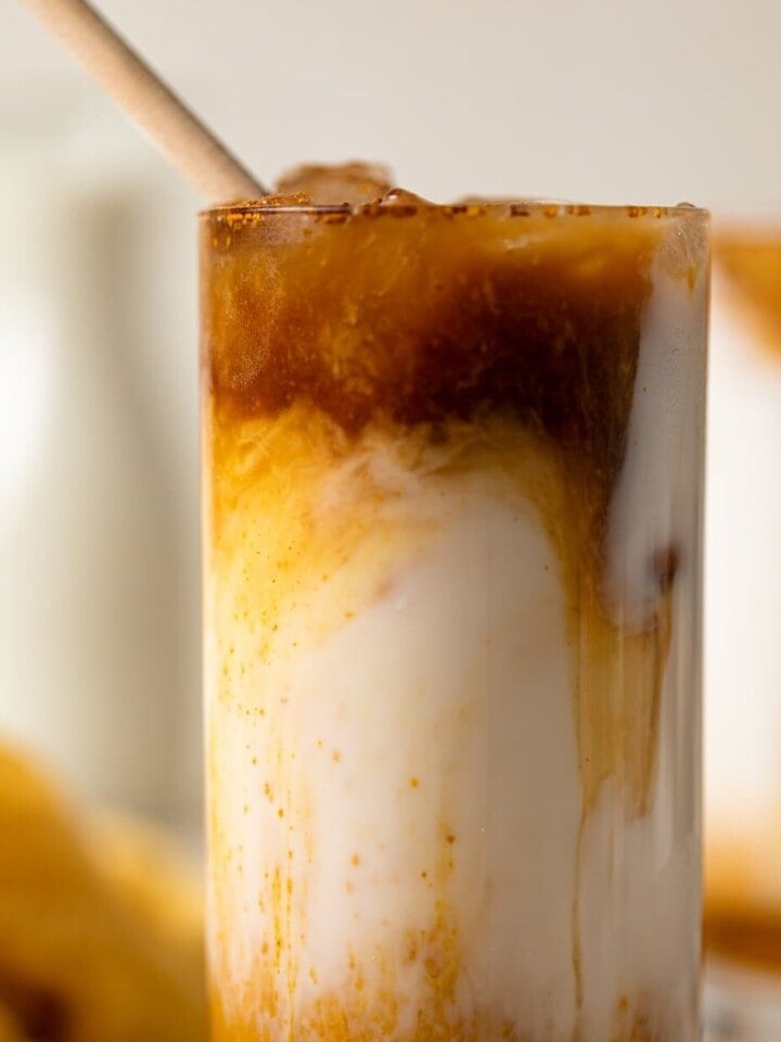 Unmixed Honey and Turmeric Iced Latte in a tall glass
