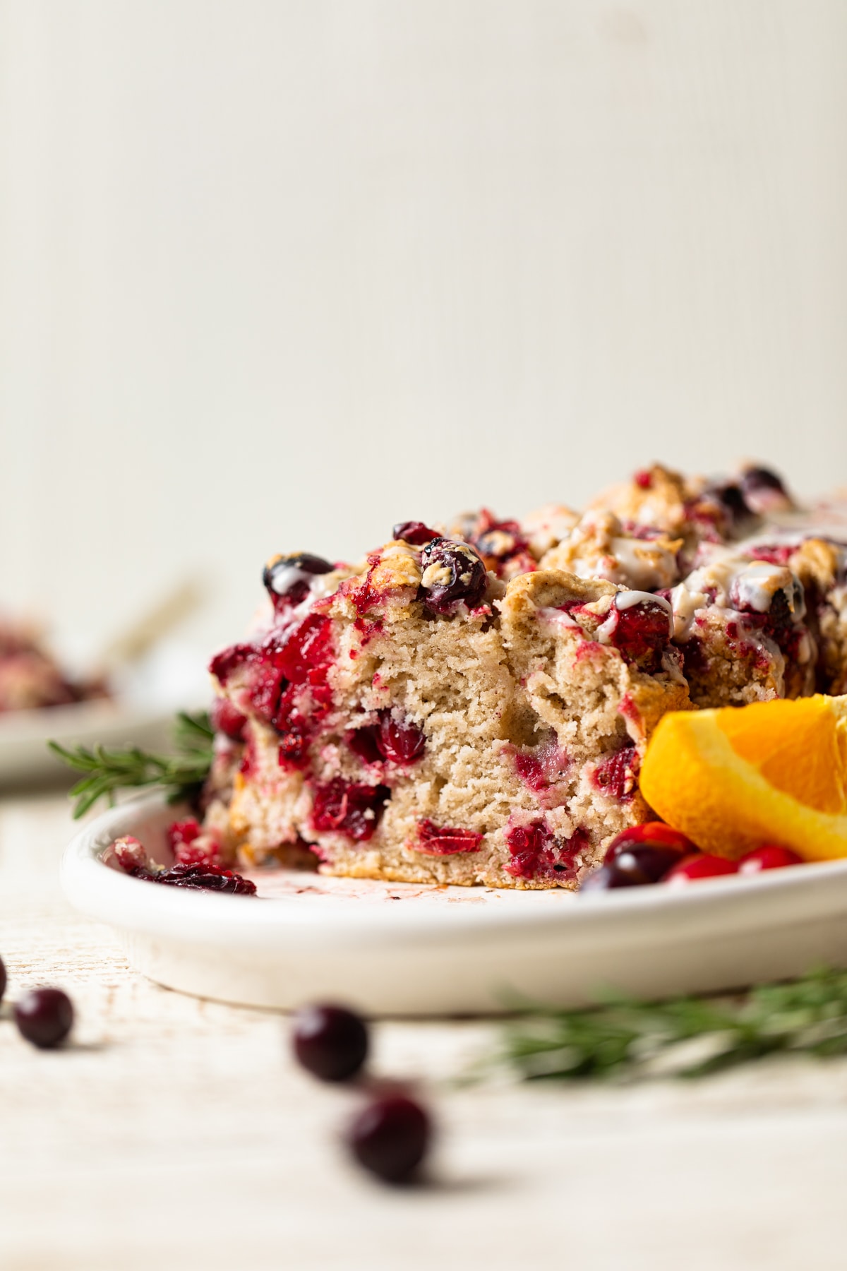 Slices of Vegan Orange Cranberry Bread on a plate