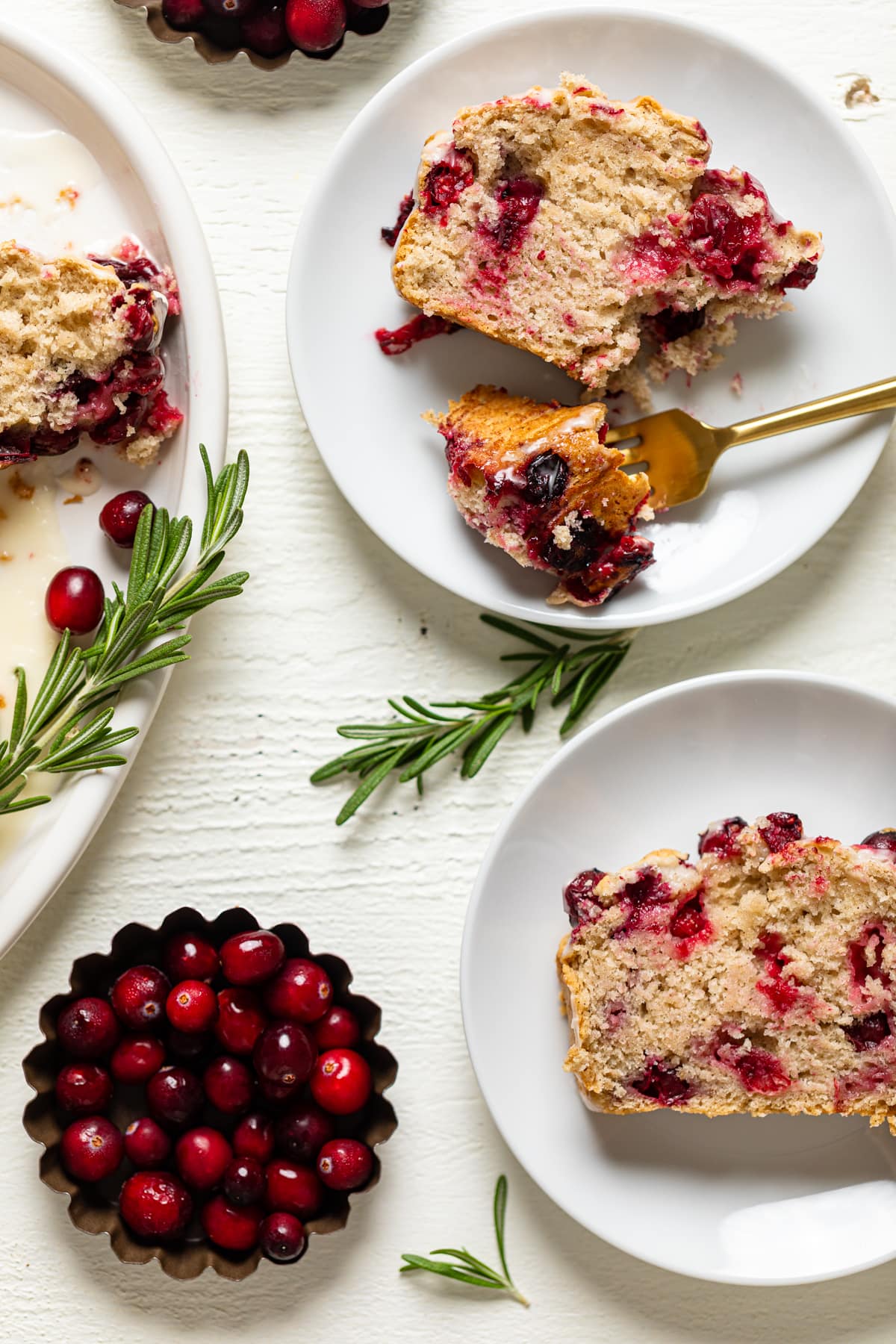 Slices of Vegan Orange Cranberry Bread on small plates