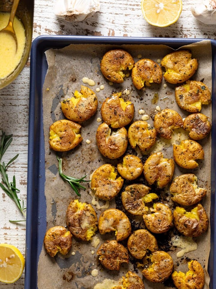 Garlic Herb Smashed Potatoes on a baking sheet